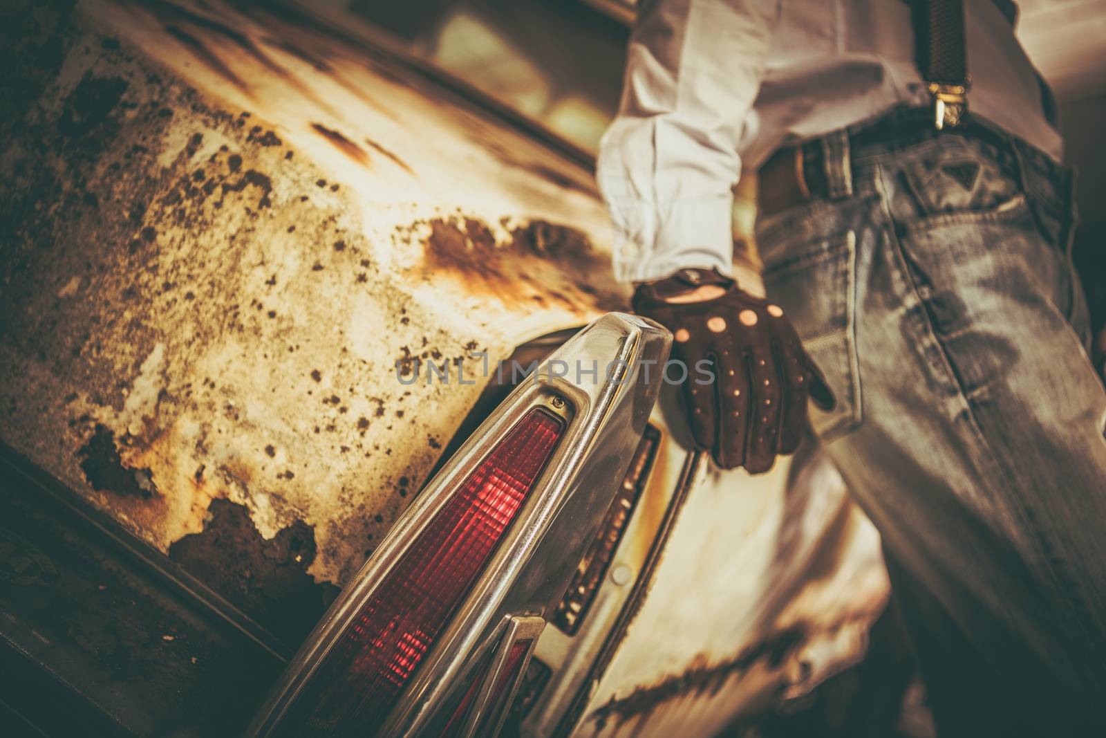 Junk Classic Car Sentiments. The Men and His Aged Classic Car. Closeup Photo.