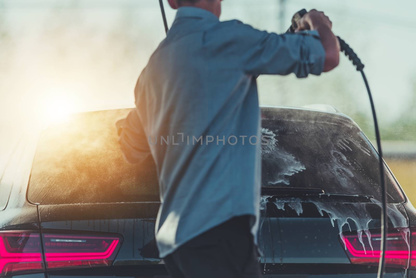 Men Washing His Car by welcomia