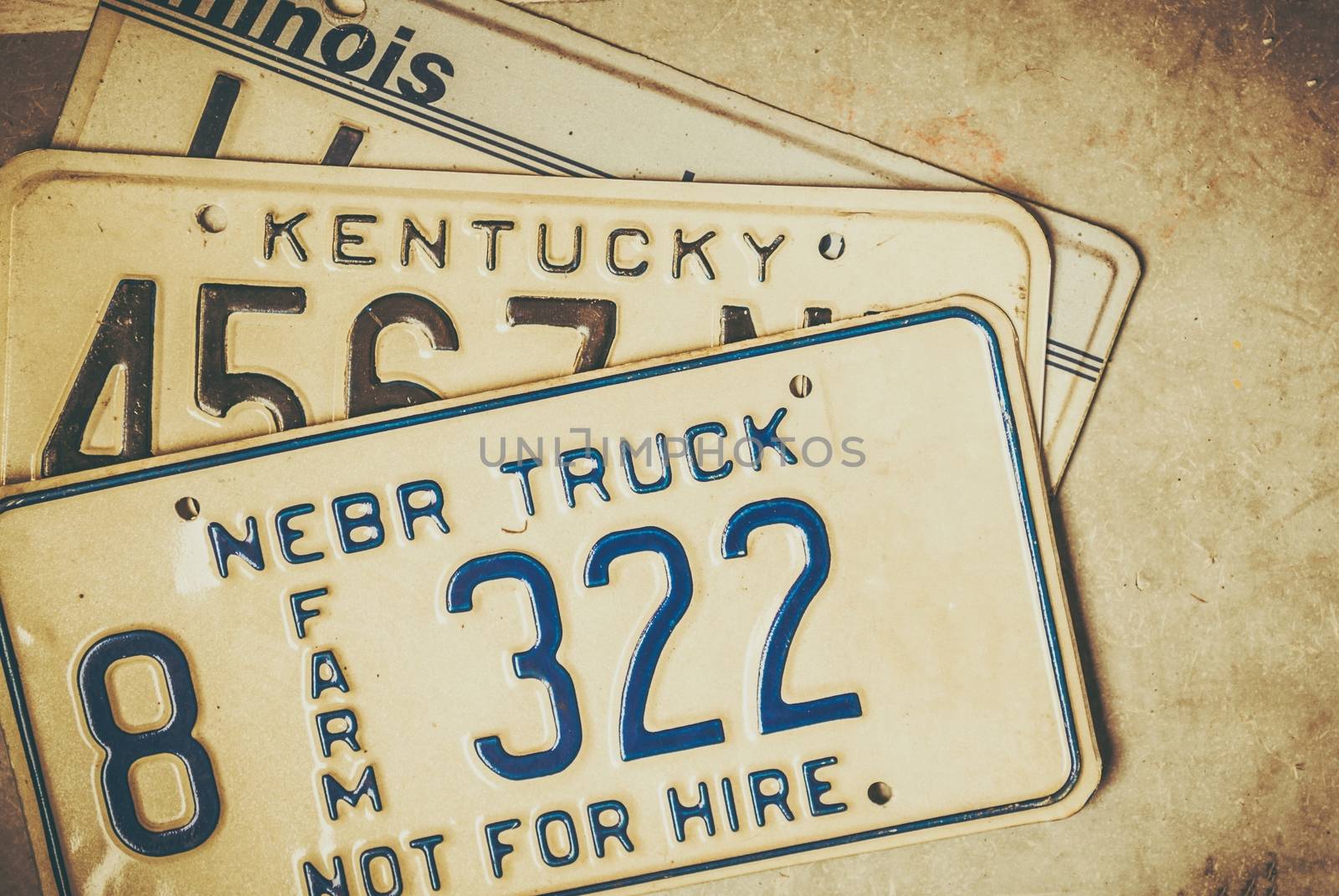 American States License Plates Closeup Photo. Nebraska, Illinois and Kentucky.