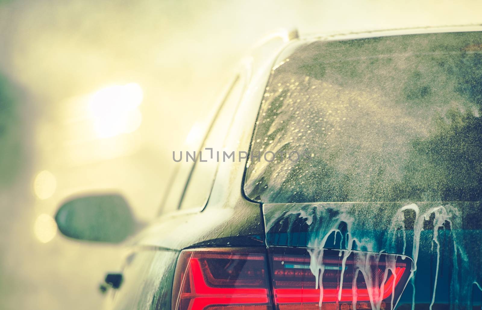 Cleaning Vehicle in Car Wash by welcomia