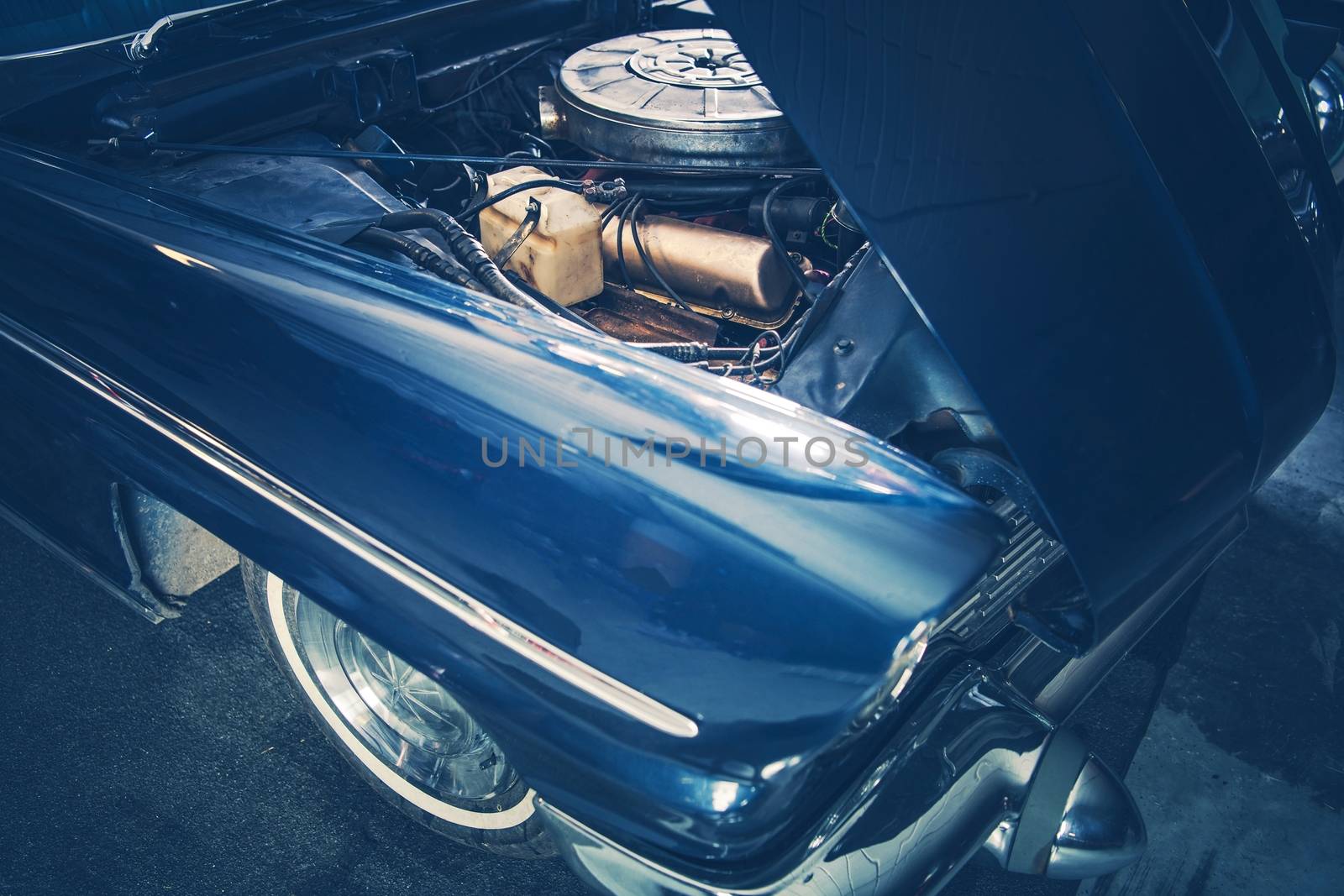 Broken Classic Car with Opened Hood. Closeup Photo. Retro Transportation Theme.