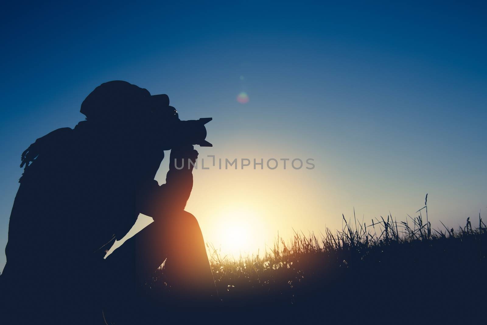 Dusk and Dawn Photography Theme. Men Taking Nature Pictures in the Remote Location.