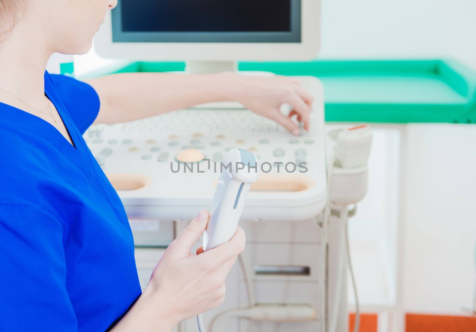 Ultrasonography Testing Equipment in Hand of Female Technician. Medical Theme.