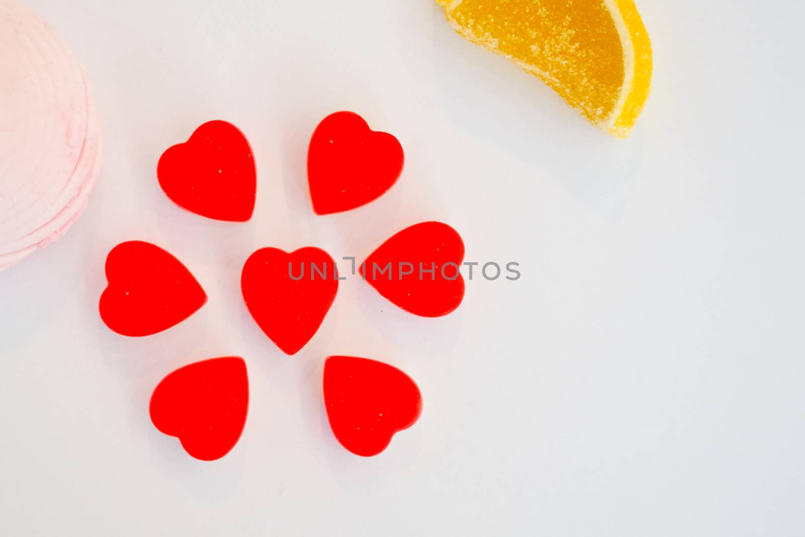 confectionery - marmalade in the form of a heart and cookies in the form of a flower