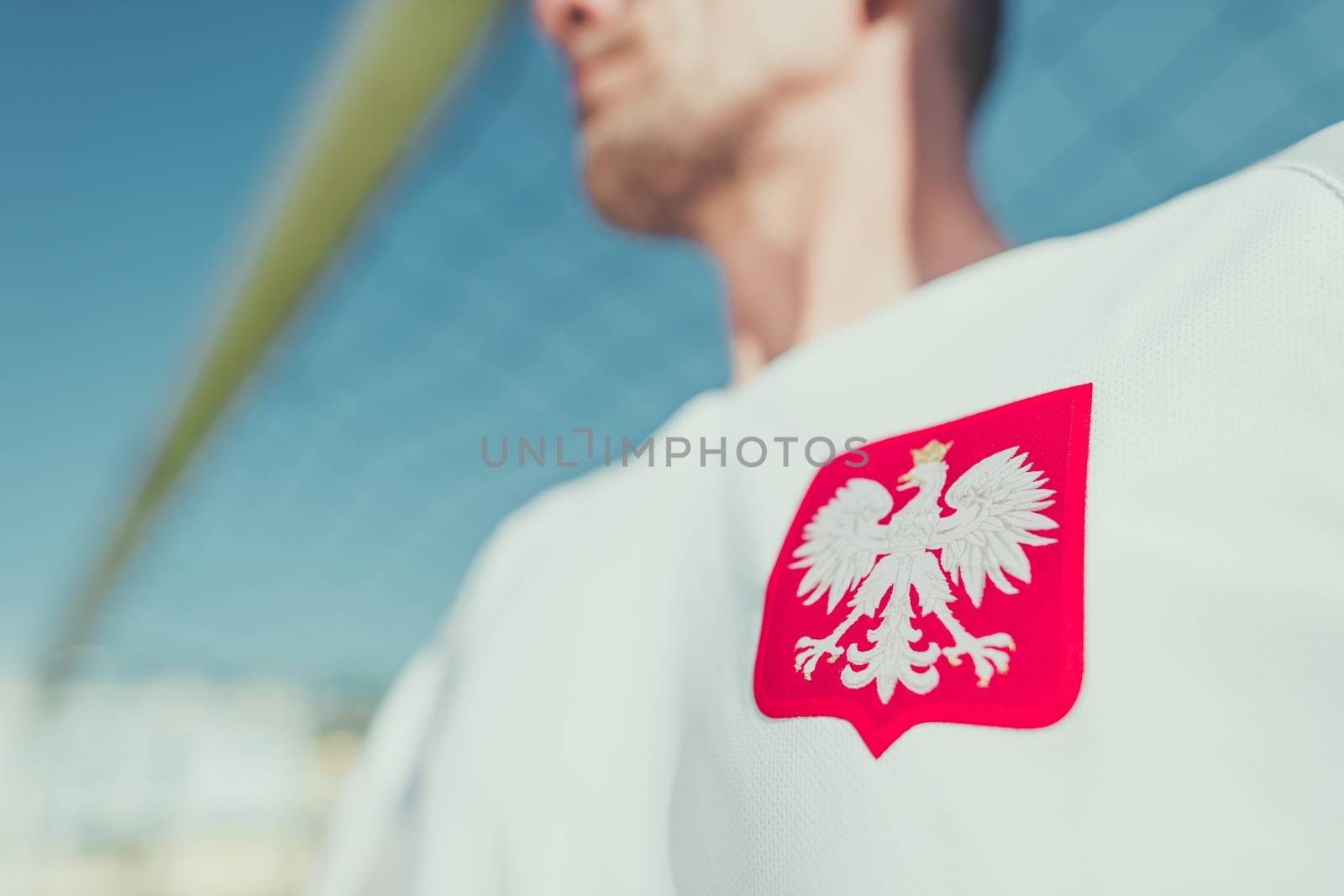 Polish Player with White Eagle National Emblem on the Tshirt. Closeup Photo. Polish National Team Player.