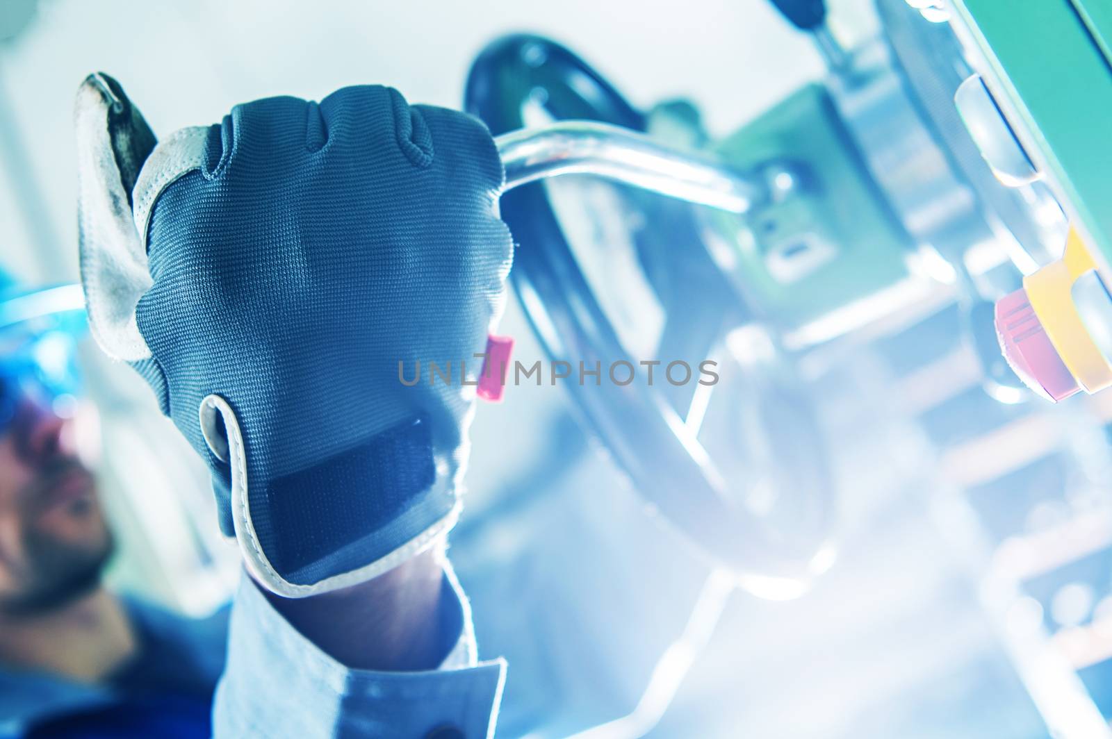 Machine Operator Closeup. Men Adjusting Lathe Machine.