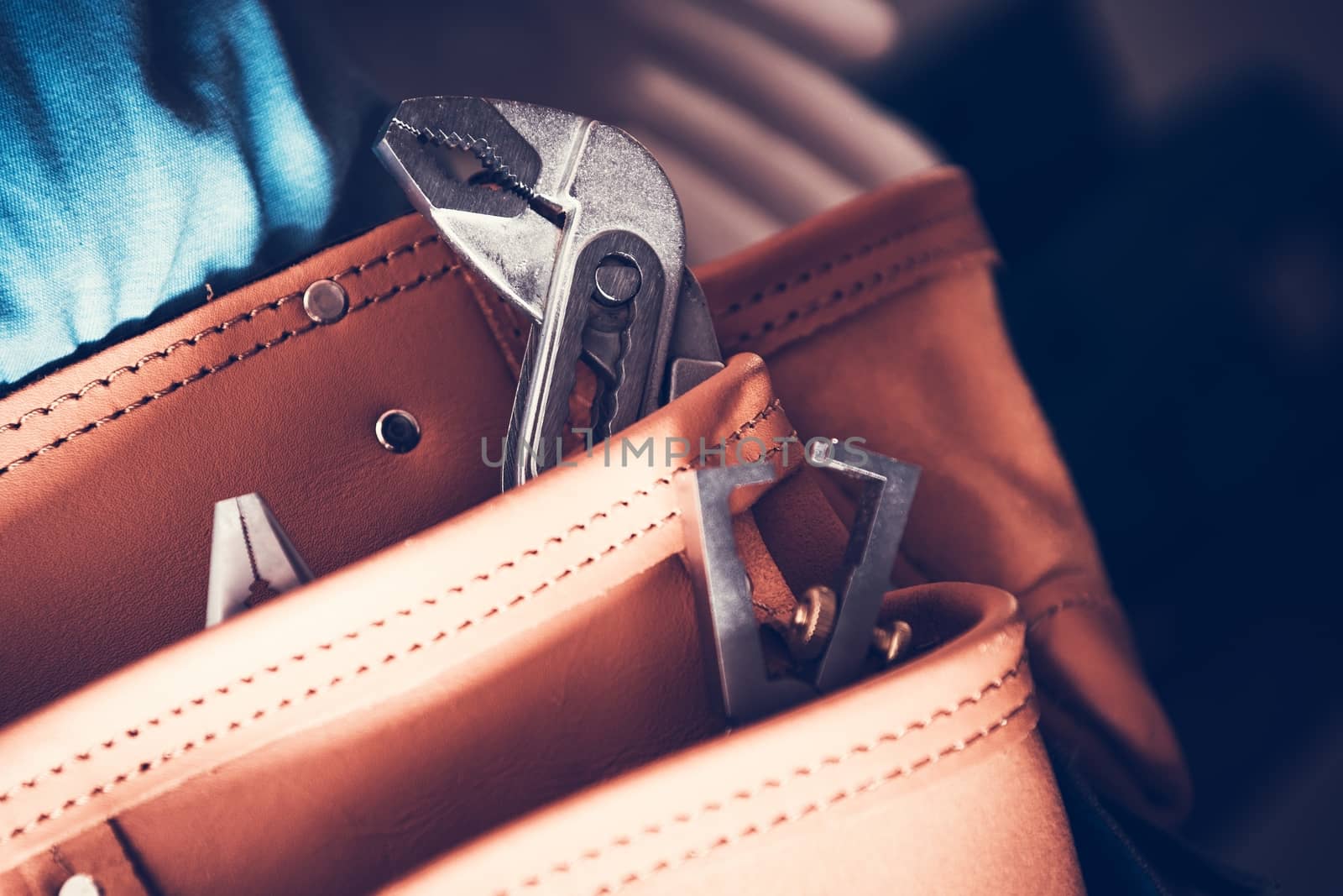 Handyman Fixing Tools Inside Leather Tool Belt. Closeup Photo. Construction Theme.