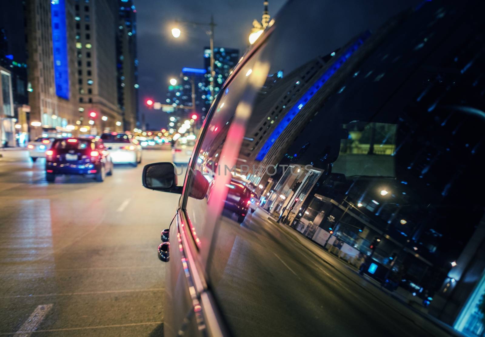 Exploring City at Night. Late Evening Car Drive in the Downtown.