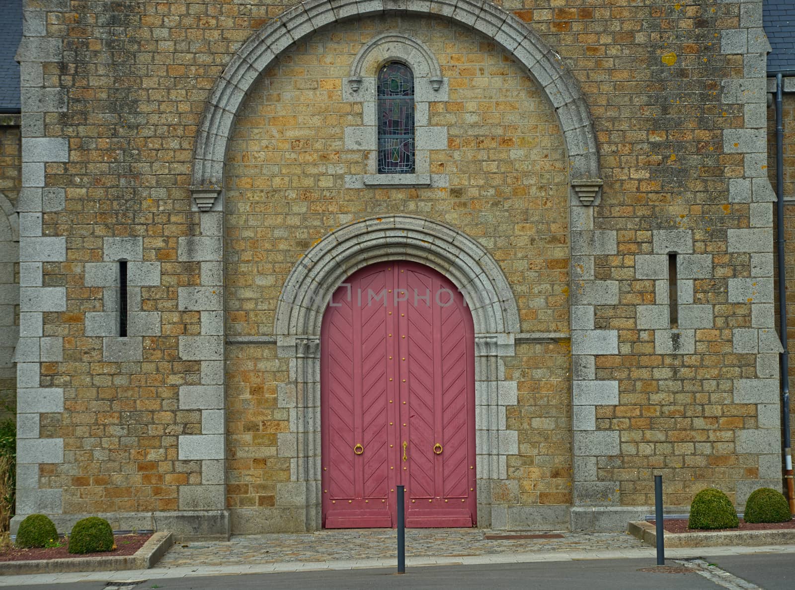 Main front entrance at big old stone catholic cathedral