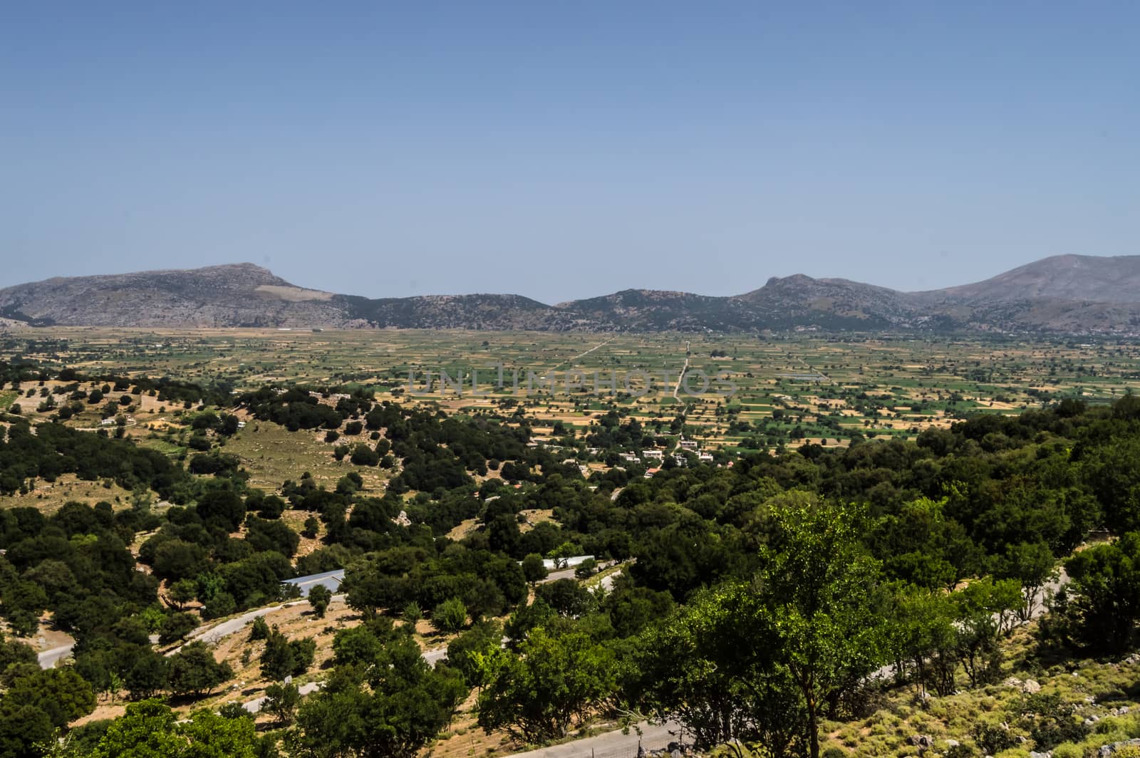 View of the fertile Lassithi Plateau in Crete. Panoramic view of the Lassithi Plateau in Crete, Greece