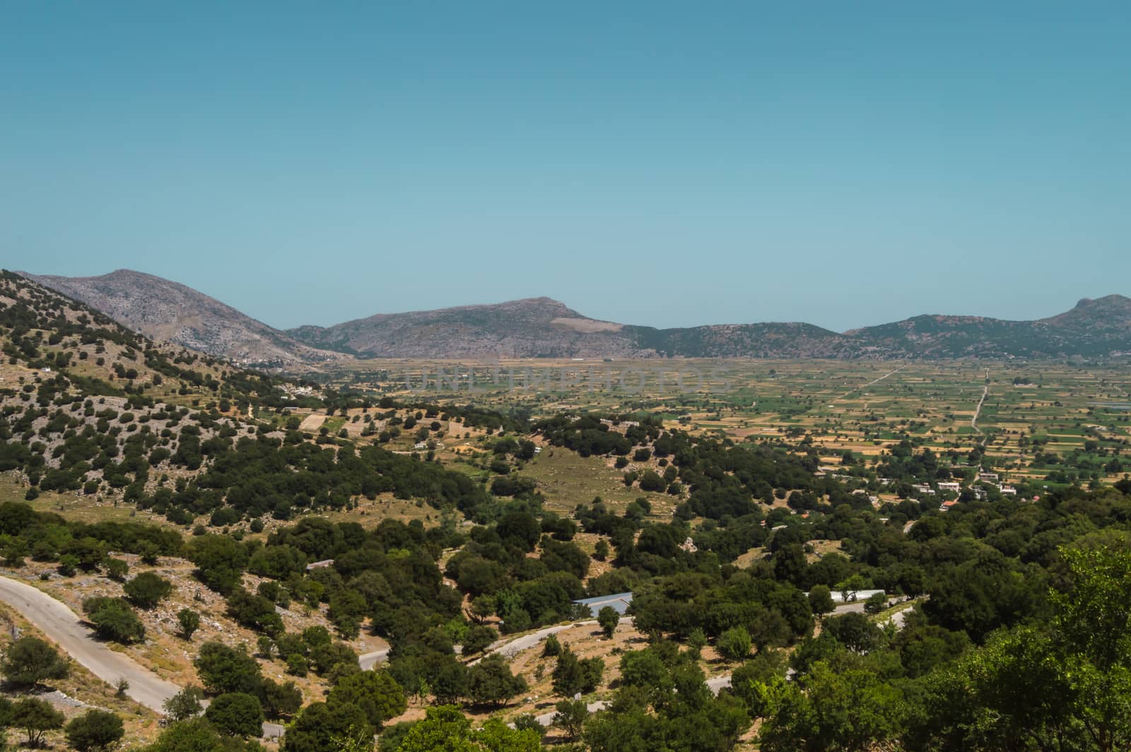 View of the fertile Lassithi Plateau in Crete. Panoramic view of the Lassithi Plateau in Crete, Greece