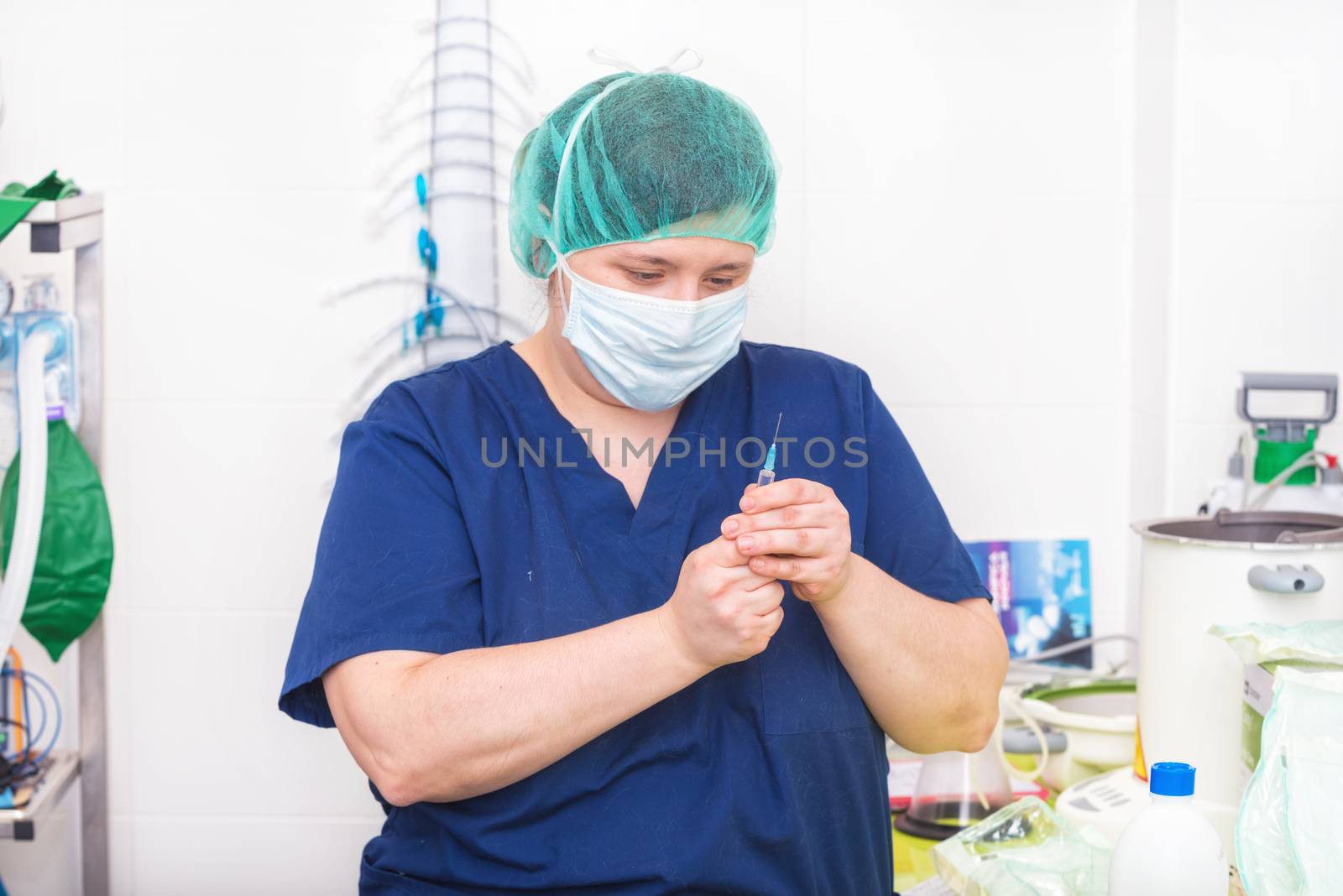 Veterinary nurse with syringe