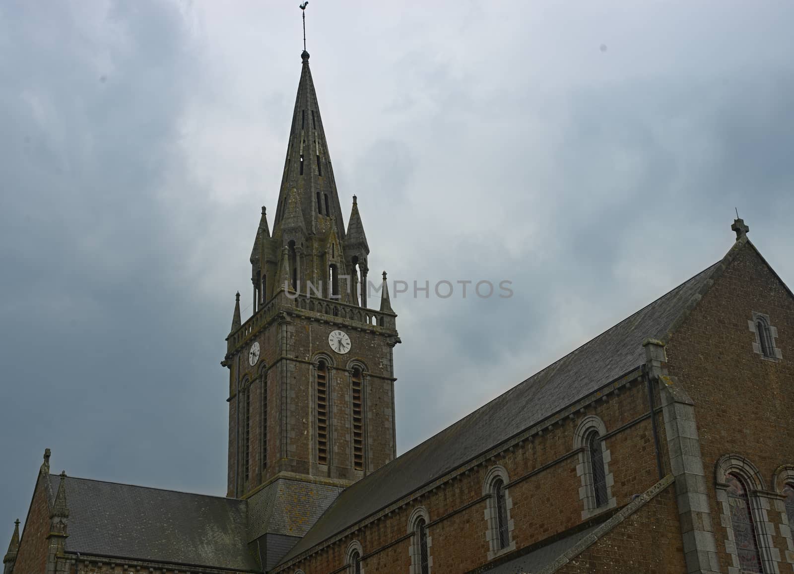 Big old stone Catholic cathedral in Sourdeval Normandy France by sheriffkule