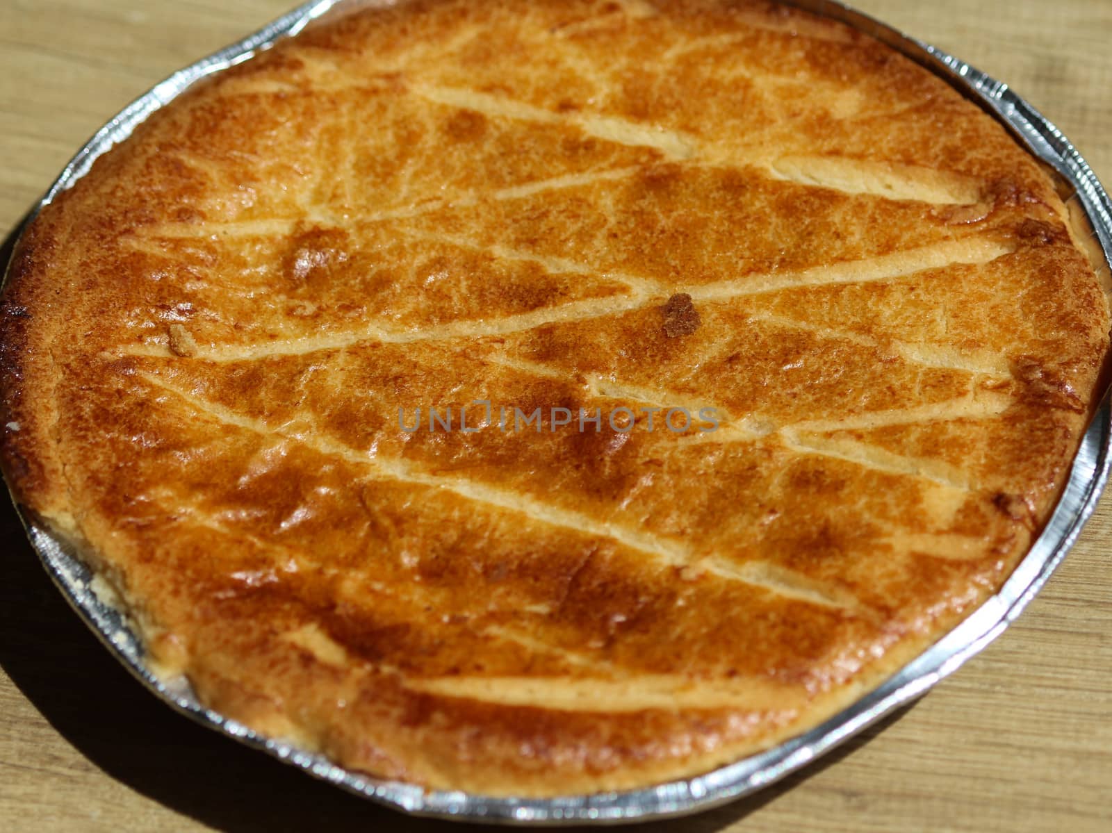 close up of Selfmade Dutch Butter Cake (Boterkoek) cookie, fresh baked from the oven. Displayed on wooden background