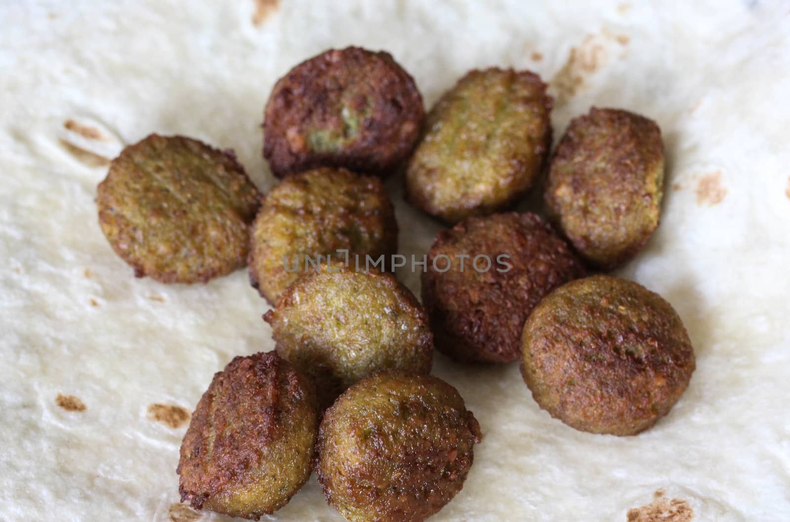 close up of baked Falafel on a wrap in kitchen