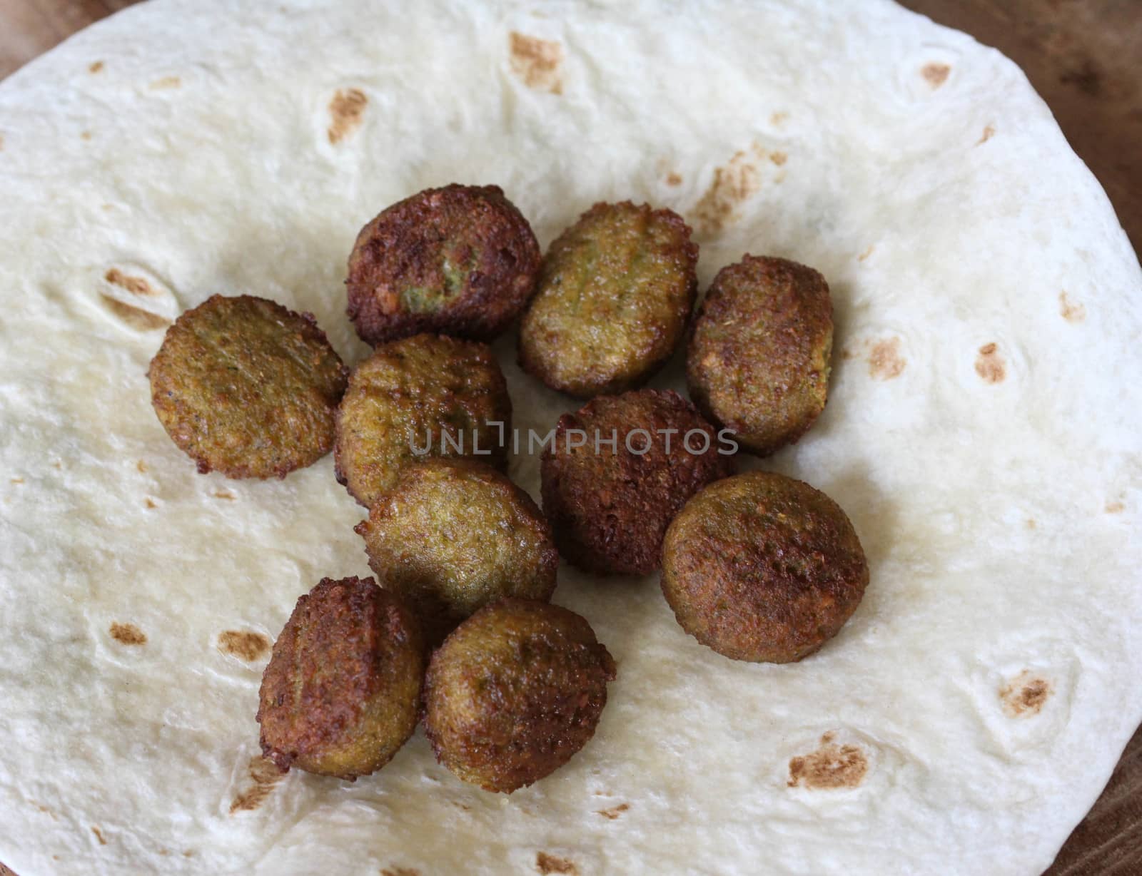 close up of baked Falafel on a wrap in kitchen