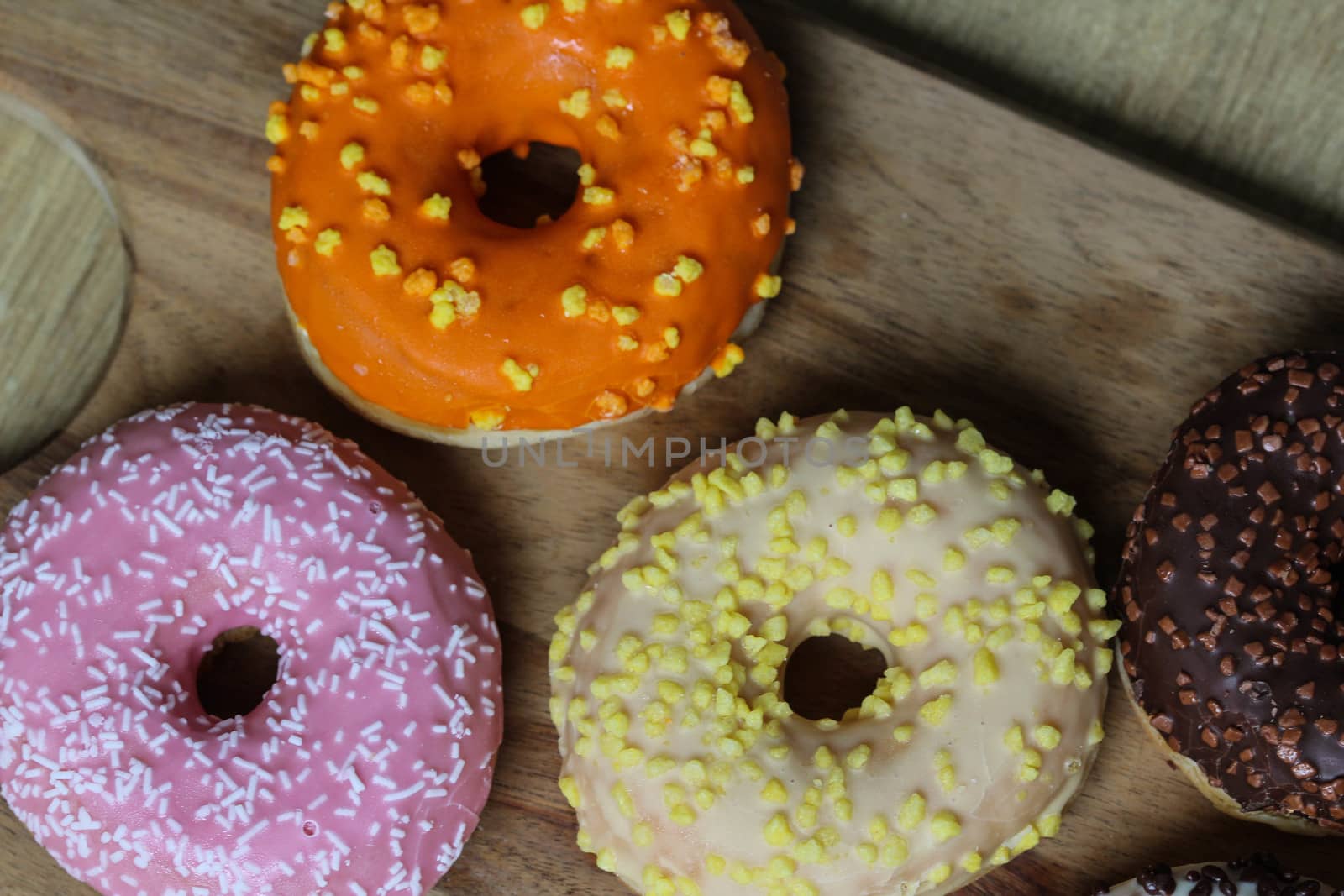 close up of different flavors of donuts