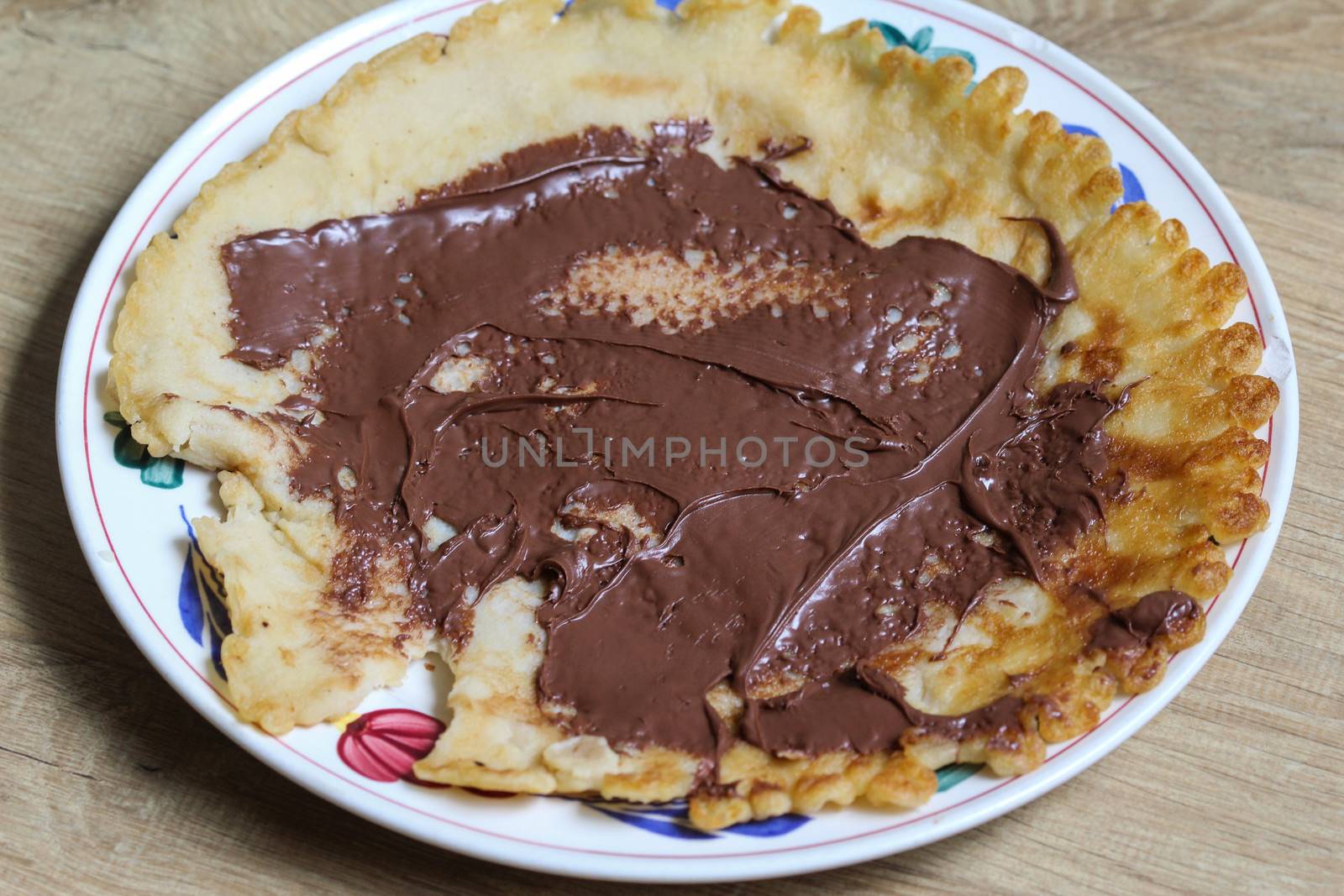 close up of pancake with chocolate pasta