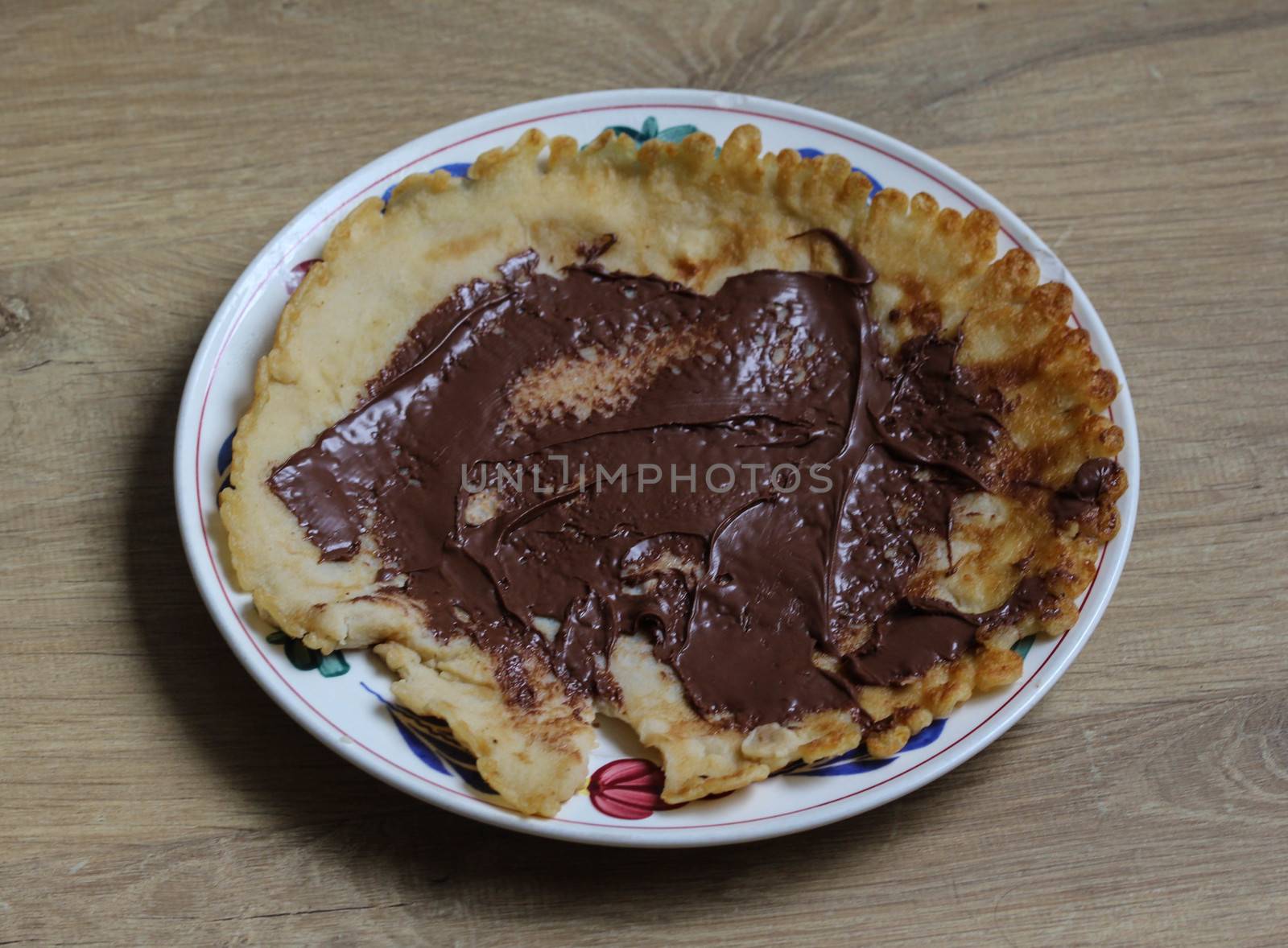 close up of pancake with chocolate pasta