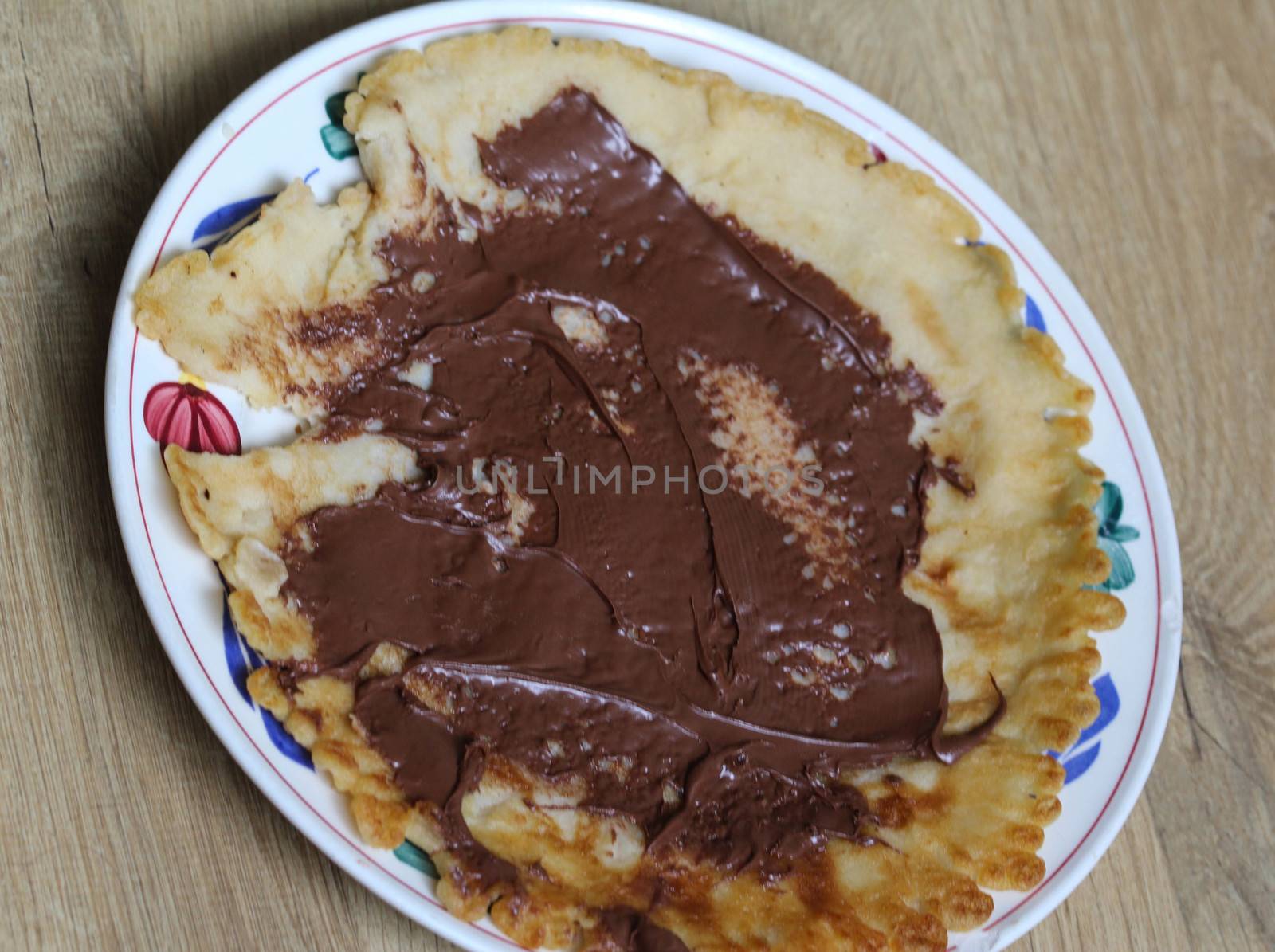 close up of pancake with chocolate pasta