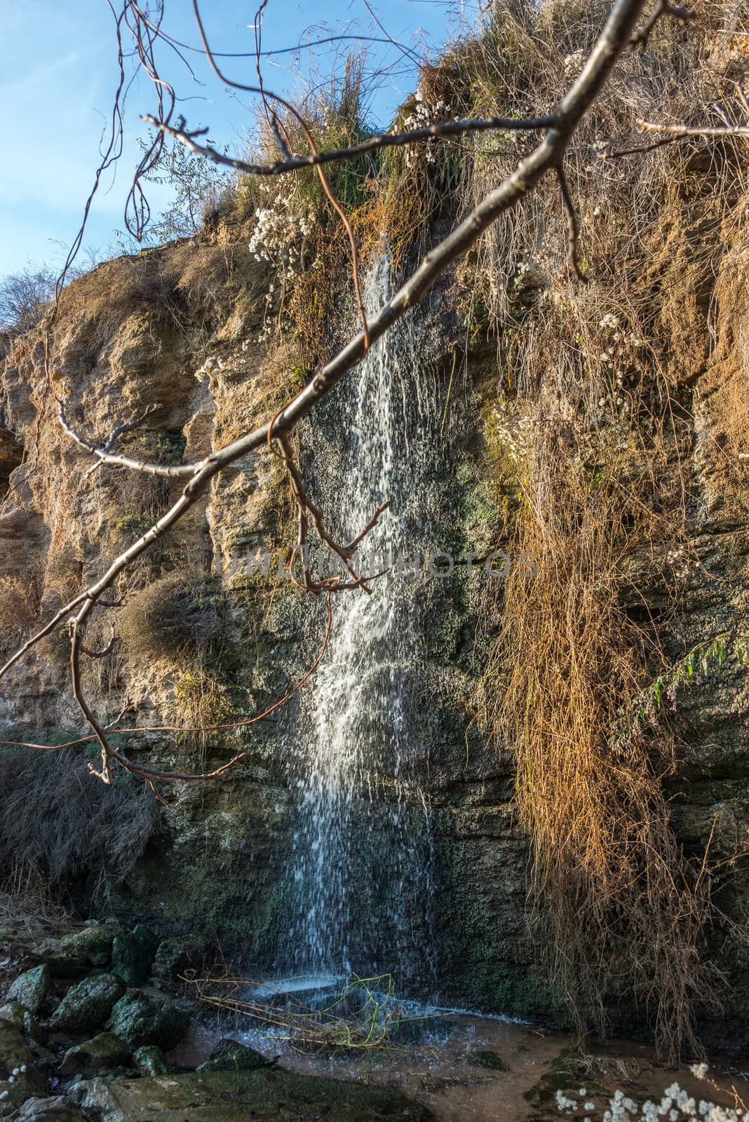 Stream and a small waterfall near the sea by Multipedia