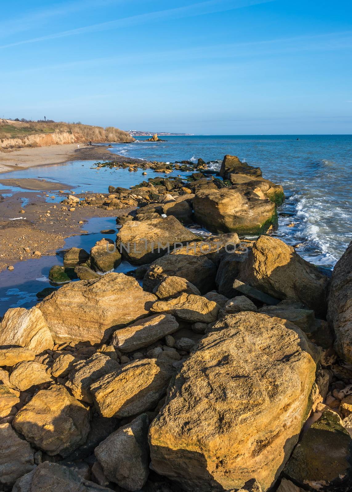 Big stones on the edge of the Black Sea. Autumn day by the sea near the village of Fontanka, Odessa region, Ukraine