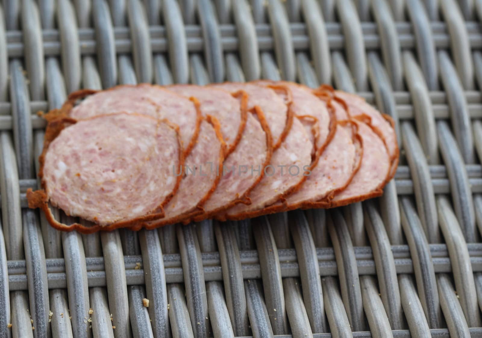 close up of Dutch grilled sausage "grillworst" on wooden table background