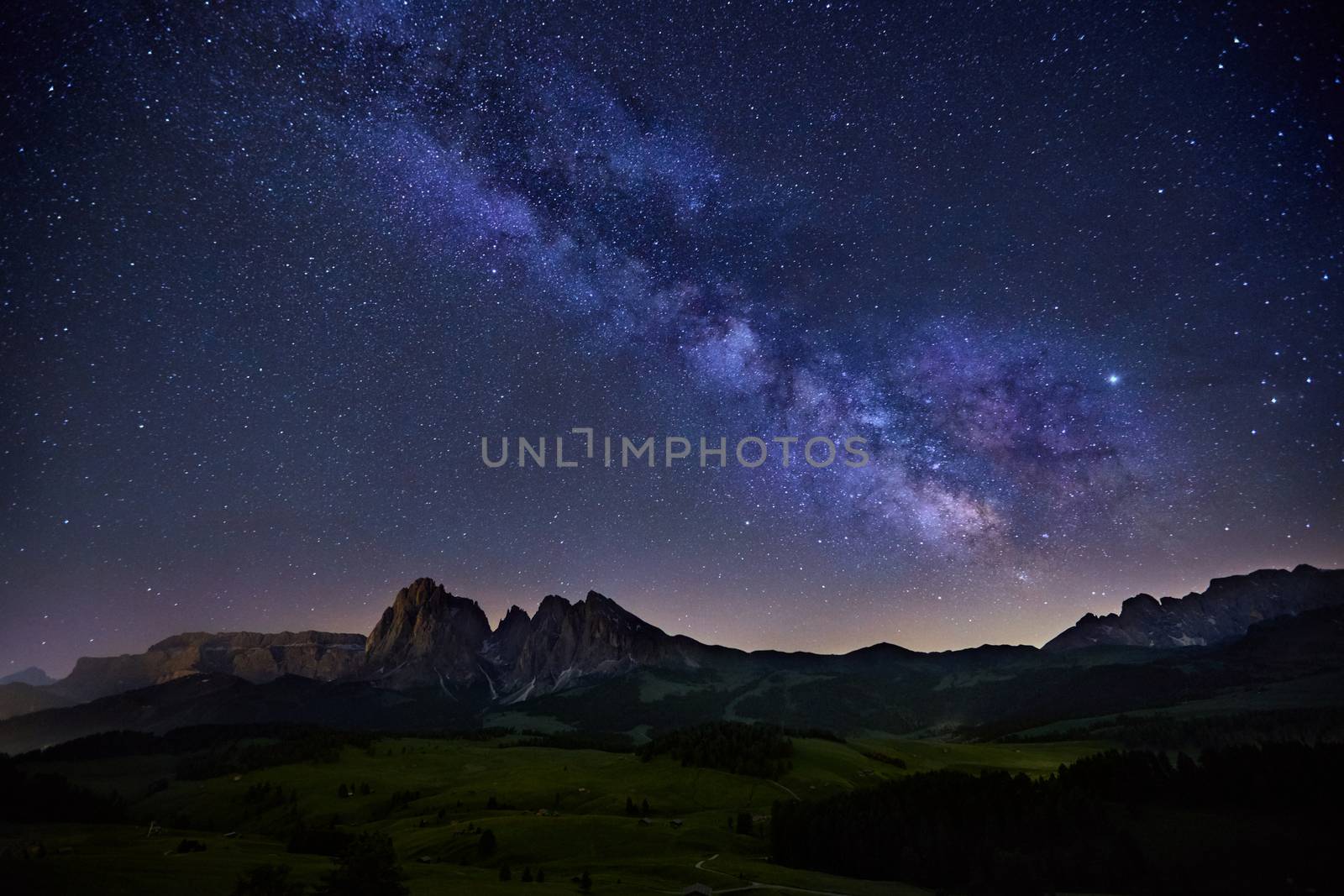 Milky Way over Alpe di Siusi (also known as Seiser Alm) in Dolomites mountain, Sudtirol, Italy