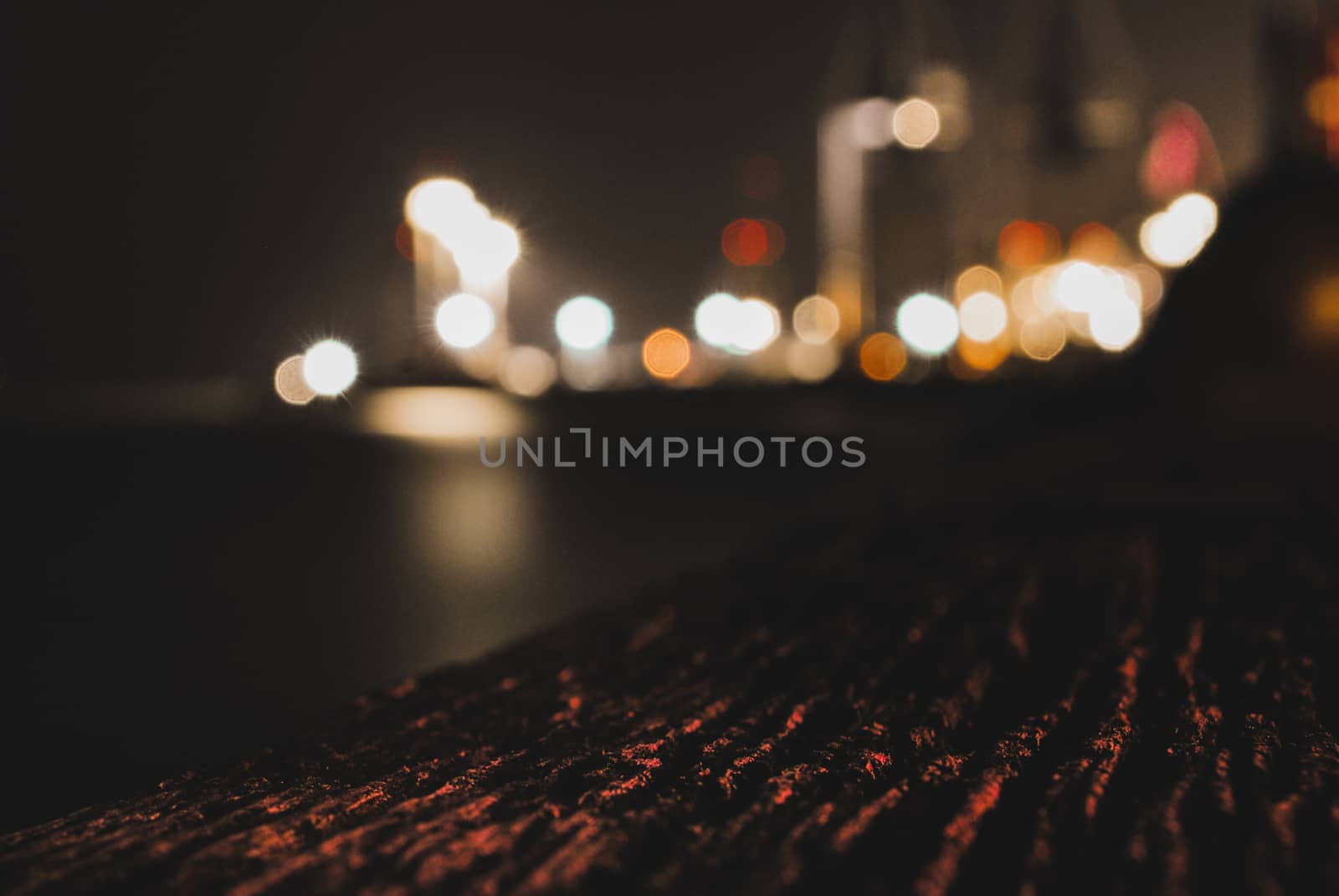 A blurry scenery of a harbour at night