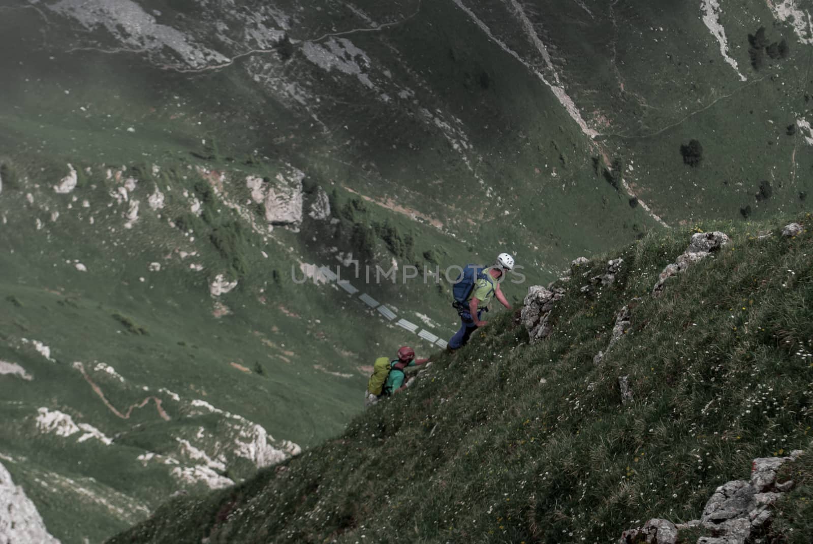Two brave climbers attacking the mountainside