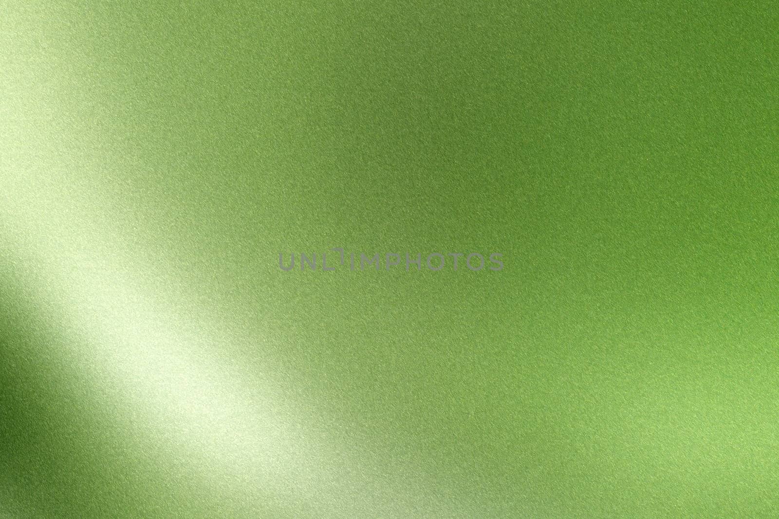 Light shining on green wave metallic wall, abstract texture background