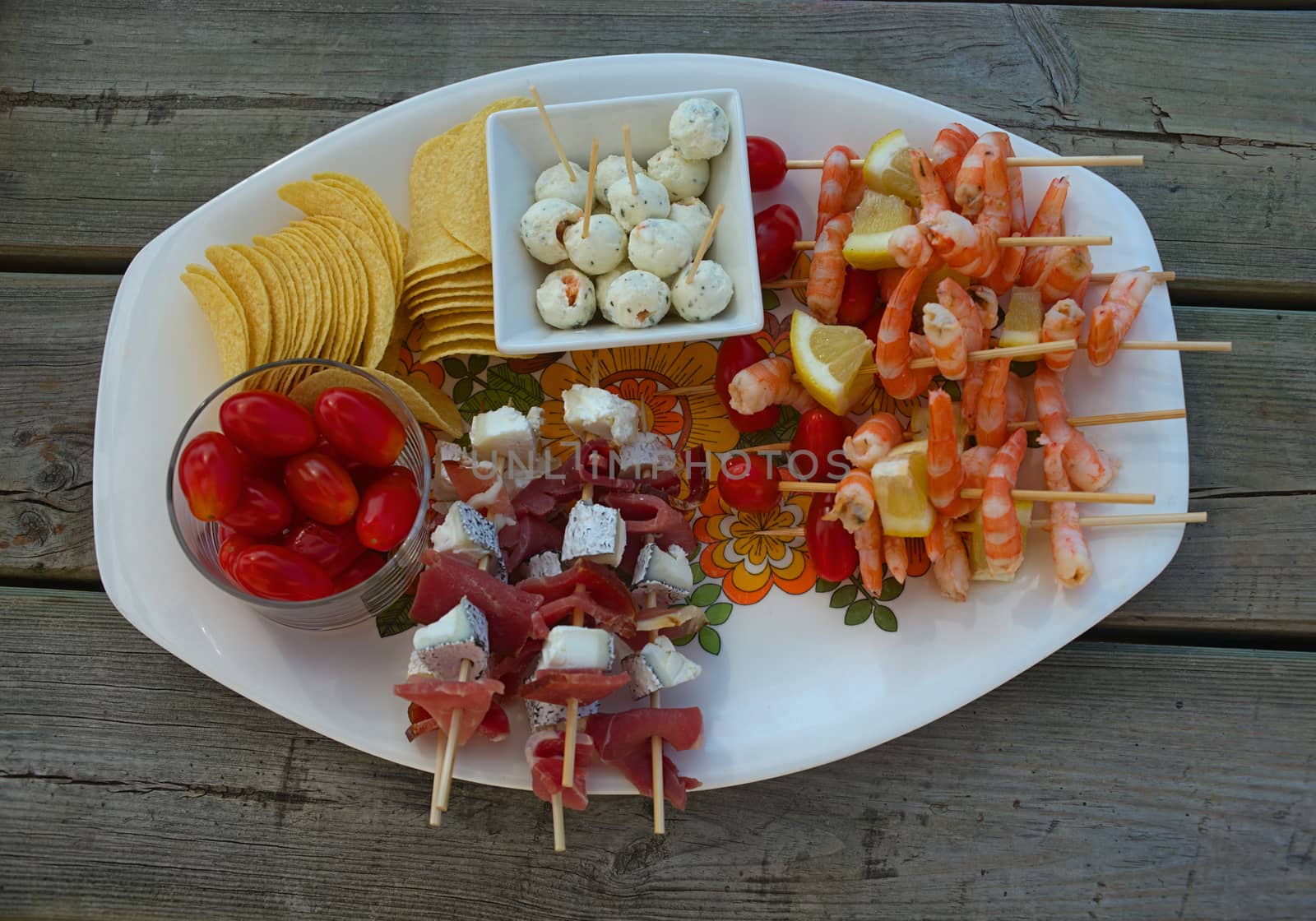 Various food prepared for appetizer on plate on wooden table