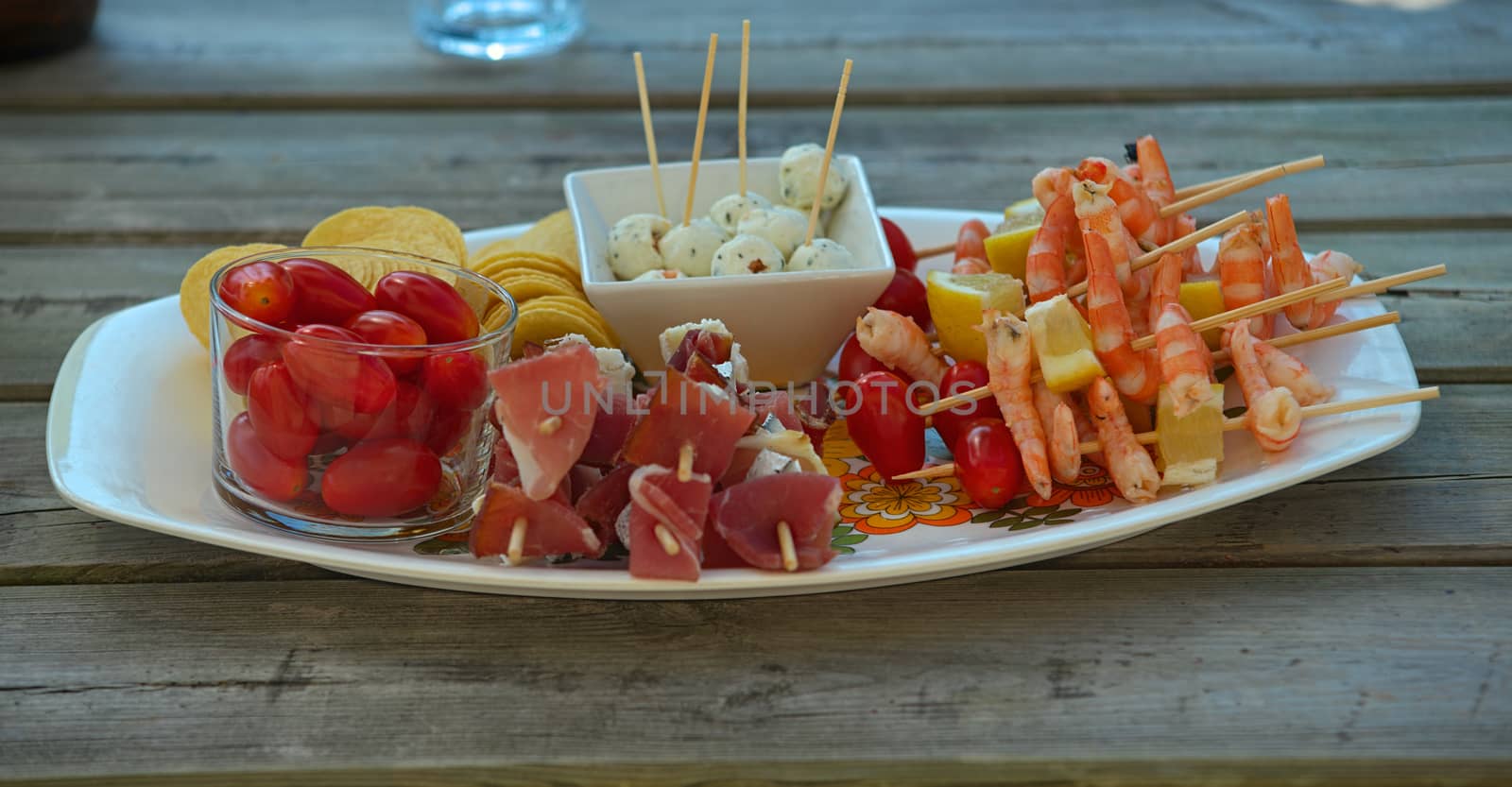 Various food prepared for appetizer on plate on wooden table by sheriffkule