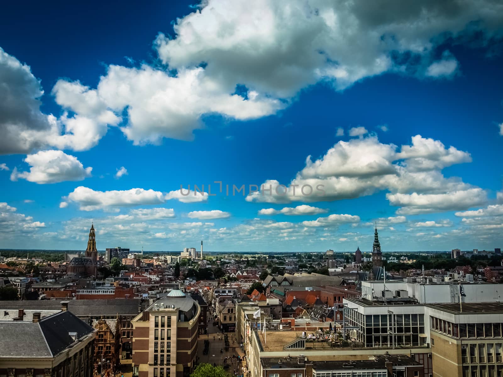 View over historic part of Groningen city under blue sky with clouds, Netherlands