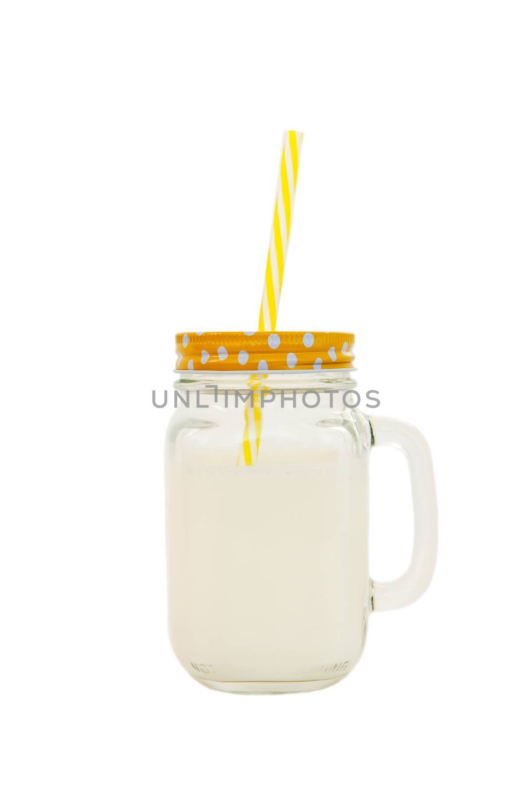 Mason jar with striped plastic tube with milk isolated on white background. Concept of World Milk Day, proper healthy nutrition. Side view. Object to use in book or social media layout. Vertical.