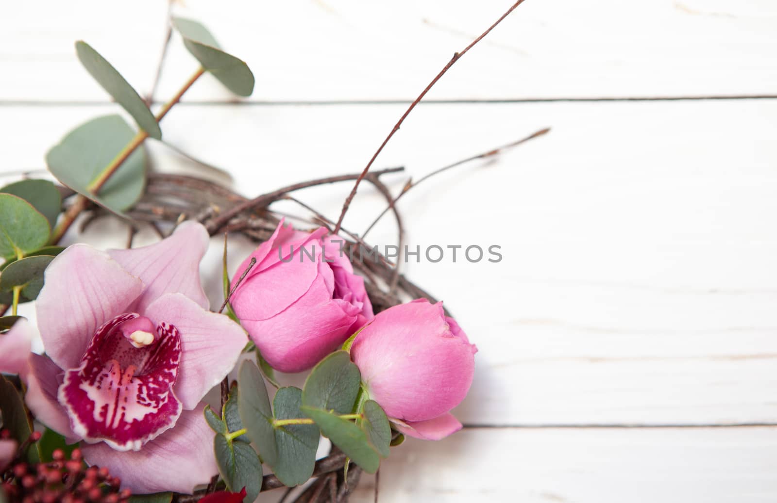 Creative flower bouquet on white wooden background. Mockup with copy space for greeting card, invitation, social media, Valentine's day, flower delivery, Mother's day, Happy Women's Day. Flat lay.