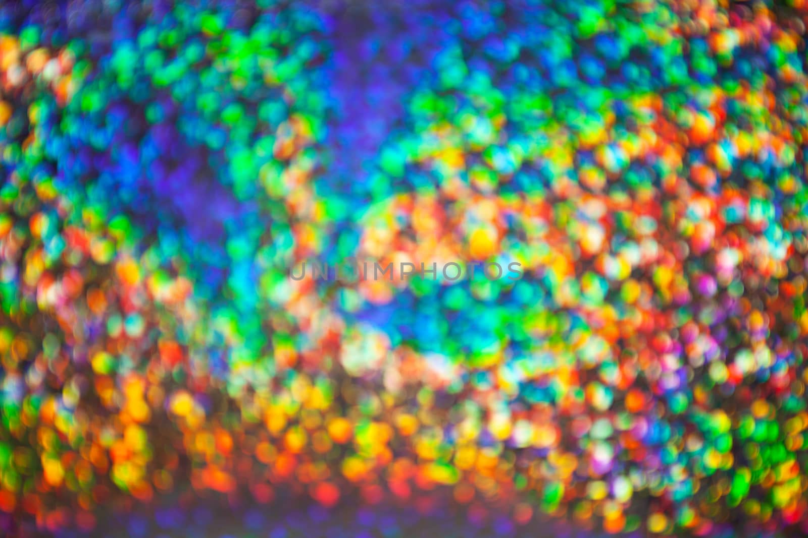 Abstract blurred background with numerous colourful bright festive bokeh. Texture with copy space for text. Celebration, holidays concept. Horizontal and vertical