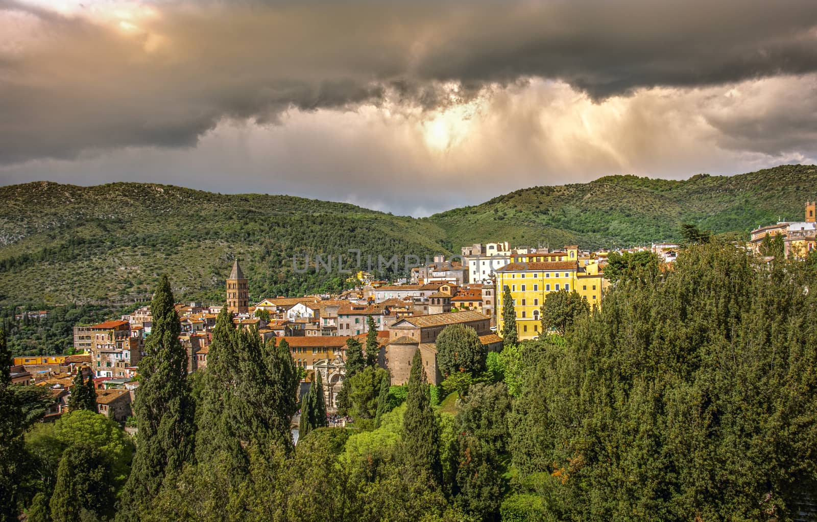 italian town of Tivoli near Rome with dramatic stormy sky by LucaLorenzelli