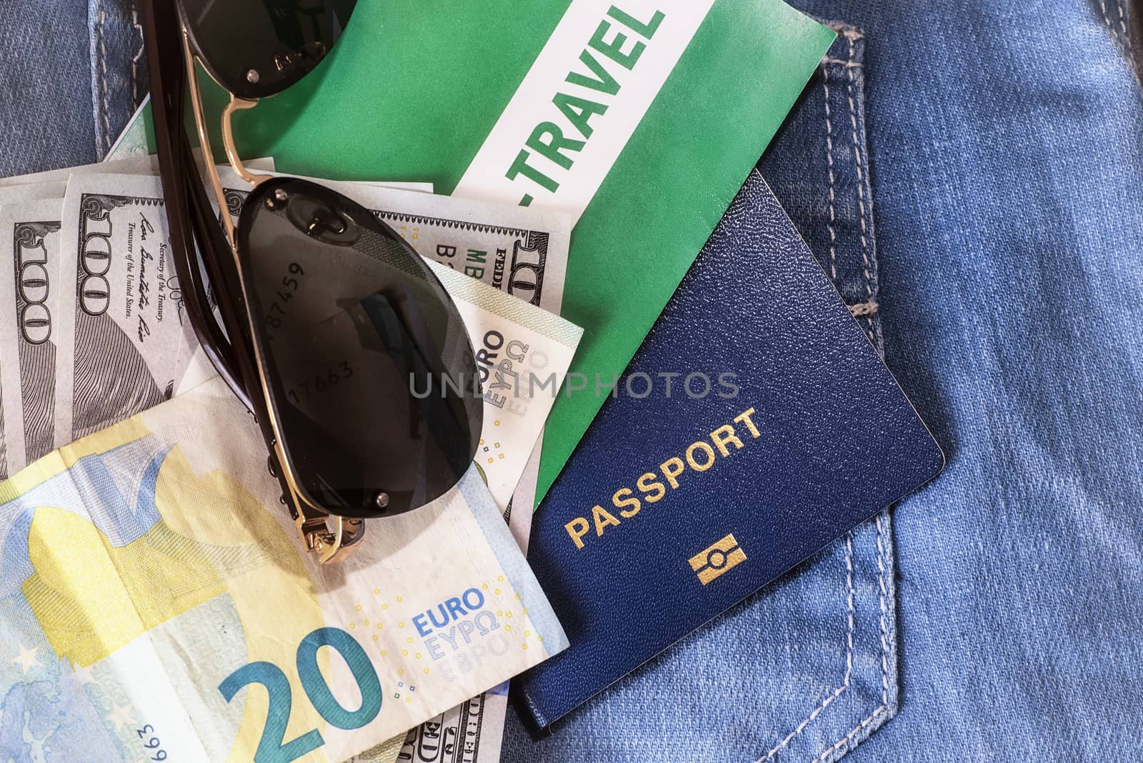 Set of trip stuff on wooden background.Travel set of passport money and tickets for travel on vacation.