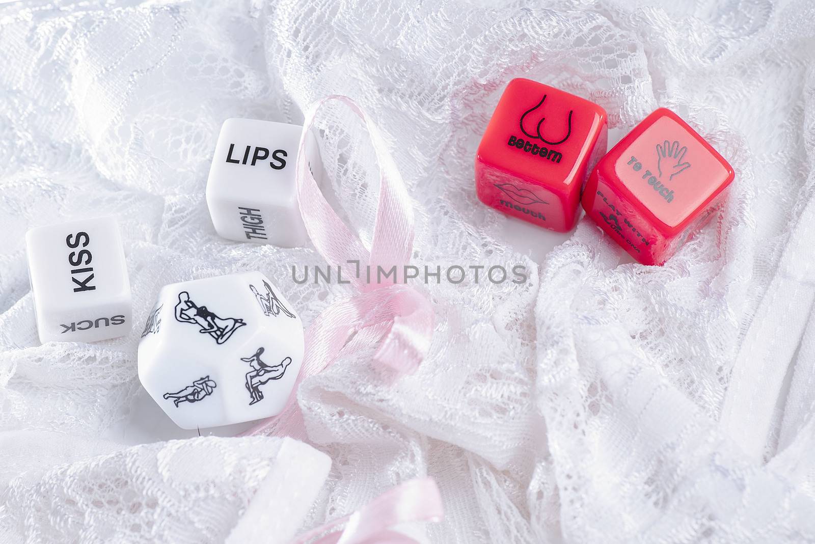 Cube with sexy poses, Kama Sutra. Toys for adults. Sex toys. Cubes with Kama Sutra poses for sex games. Playing cubes of red and white color for sexual games.