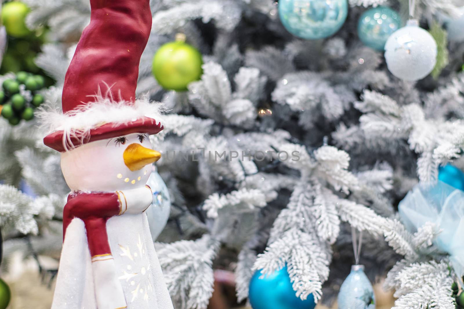 Christmas snowman.Festive snowman with Christmas light background.