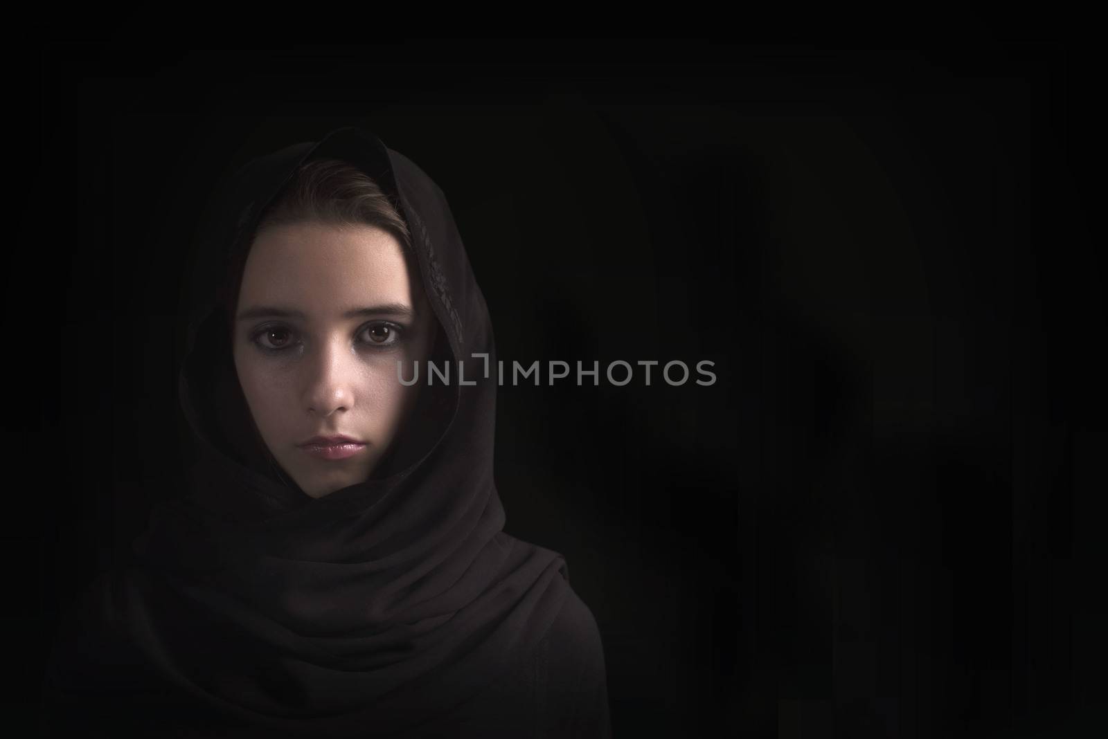 Arab girl close-up. Eyes of the Arab girl.Young arabian woman in hijab. close-up beautiful mysterious eyes eastern woman wearing a hijab
