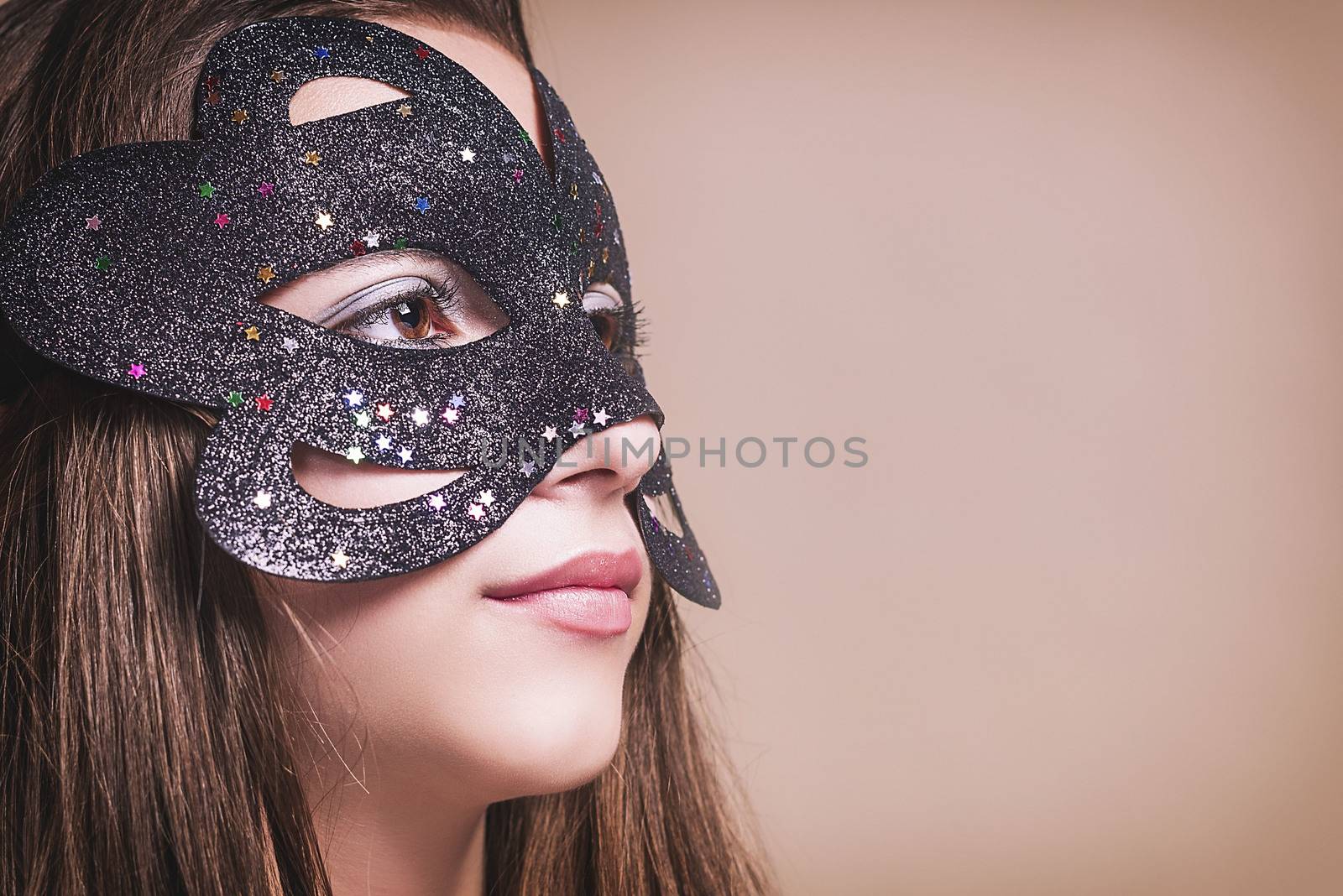 Beautiful girl in black masquerade mask.Close-up.?opy spase.