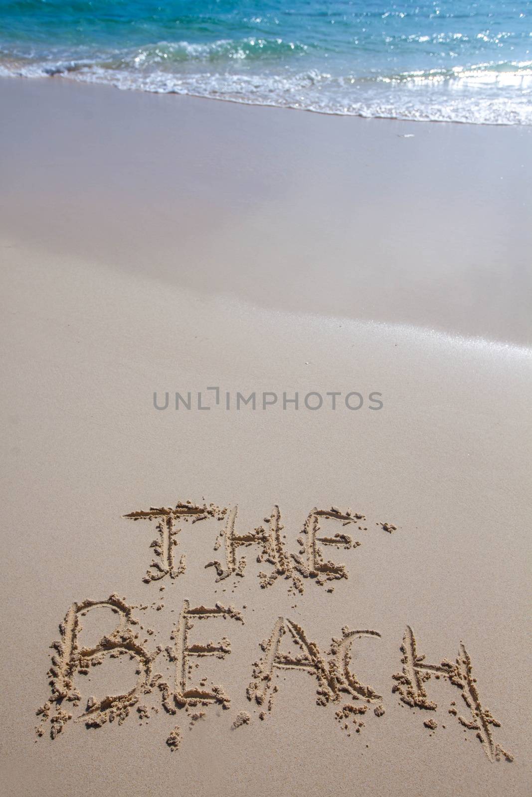 The beach words writing on tropical sea beach
