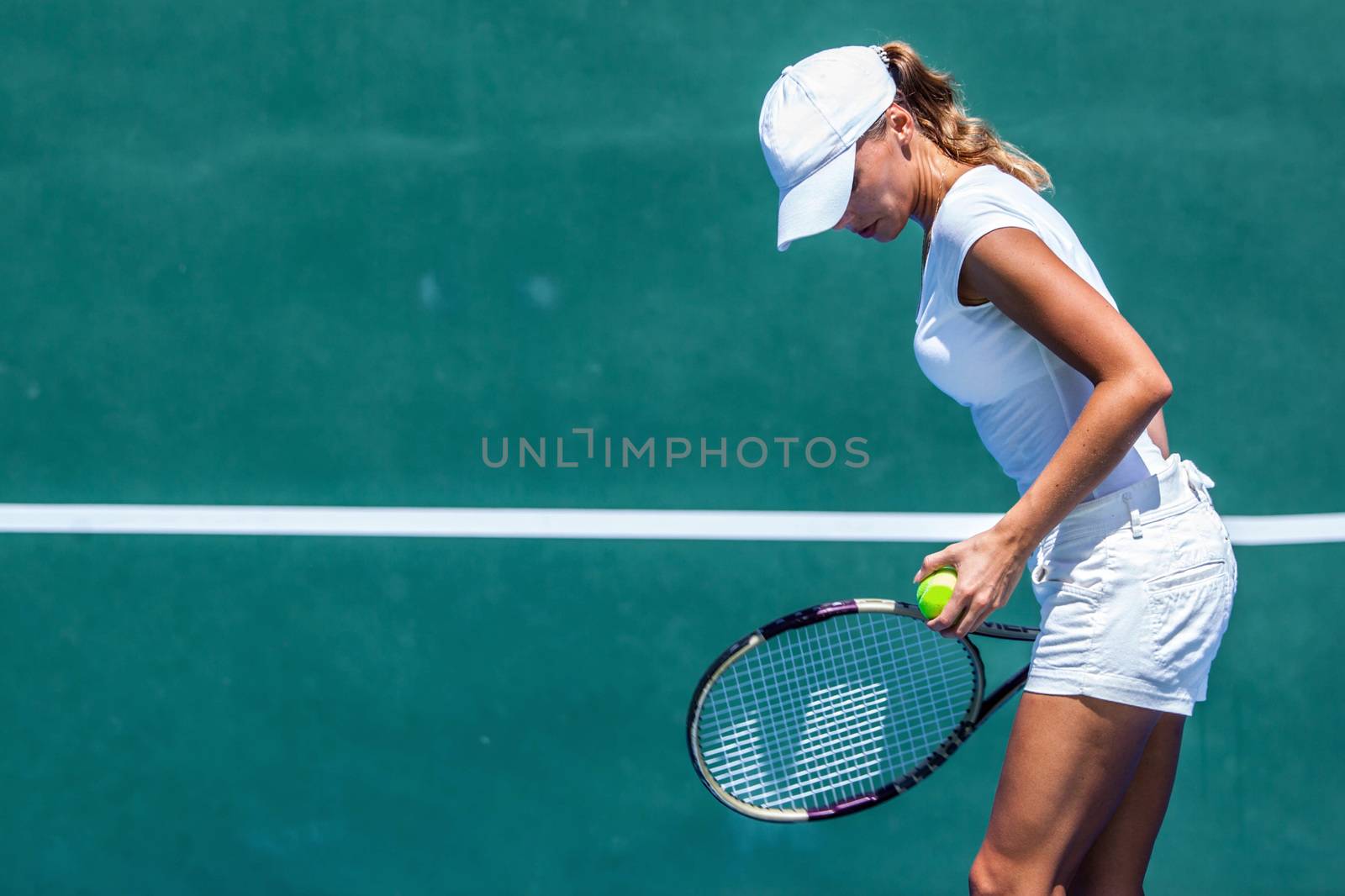 Female tennis player on court outdoors