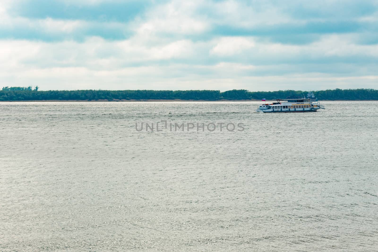View of the Amur river against the blue sky with white beautiful clouds. Bright spring sun. Russia, Khabarovsk. by rdv27