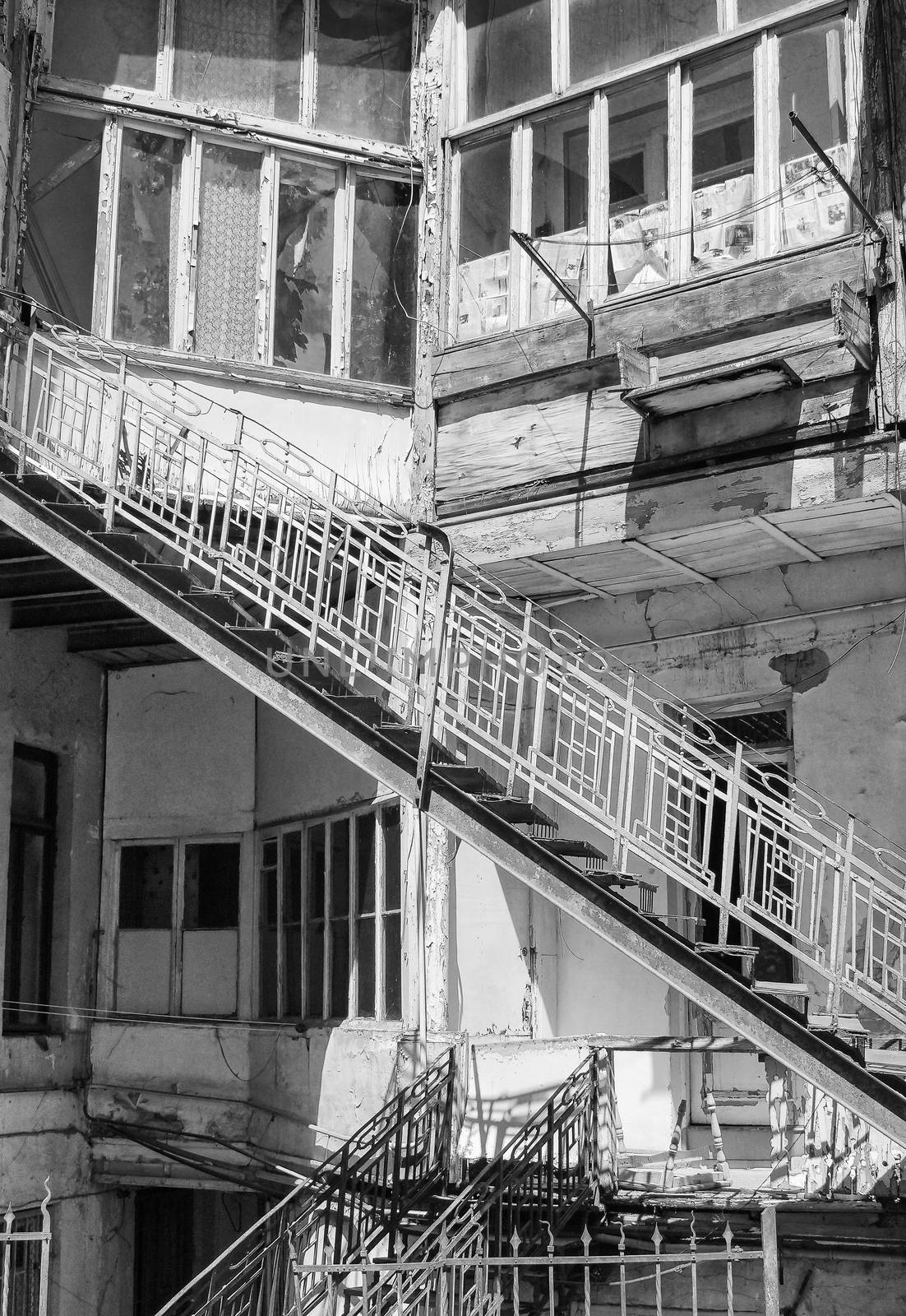 Detail image of an run-down apartment building with stairs 