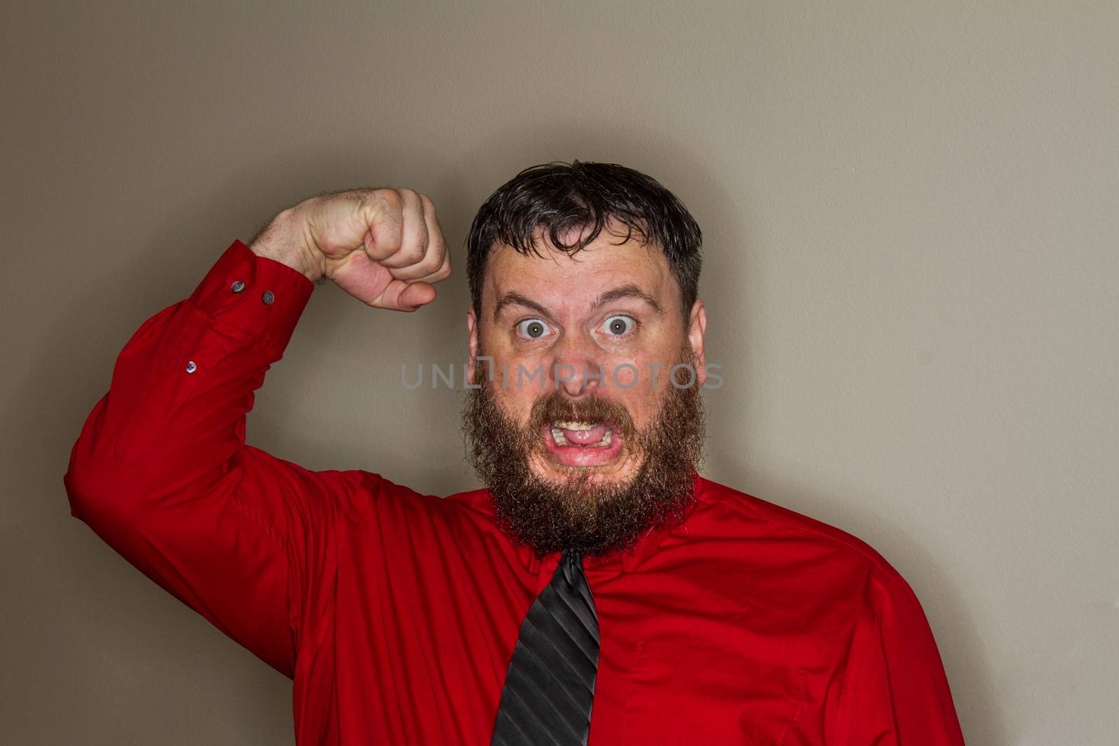 angry coworker raising his fist in anger