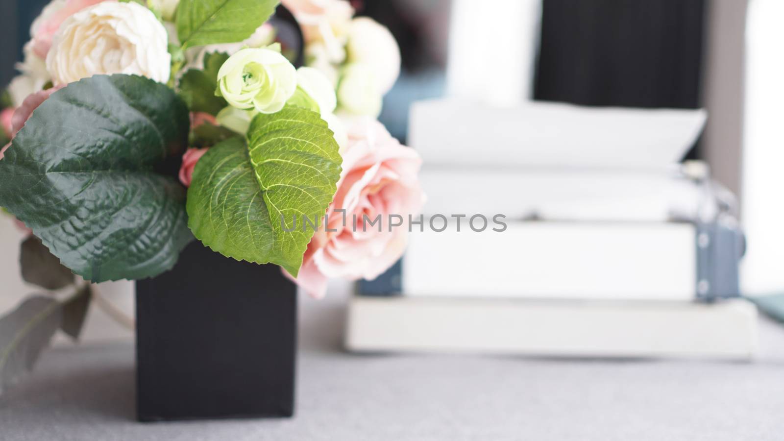 Female workspace with flowers bouquet on white background. Womens office desk by natali_brill