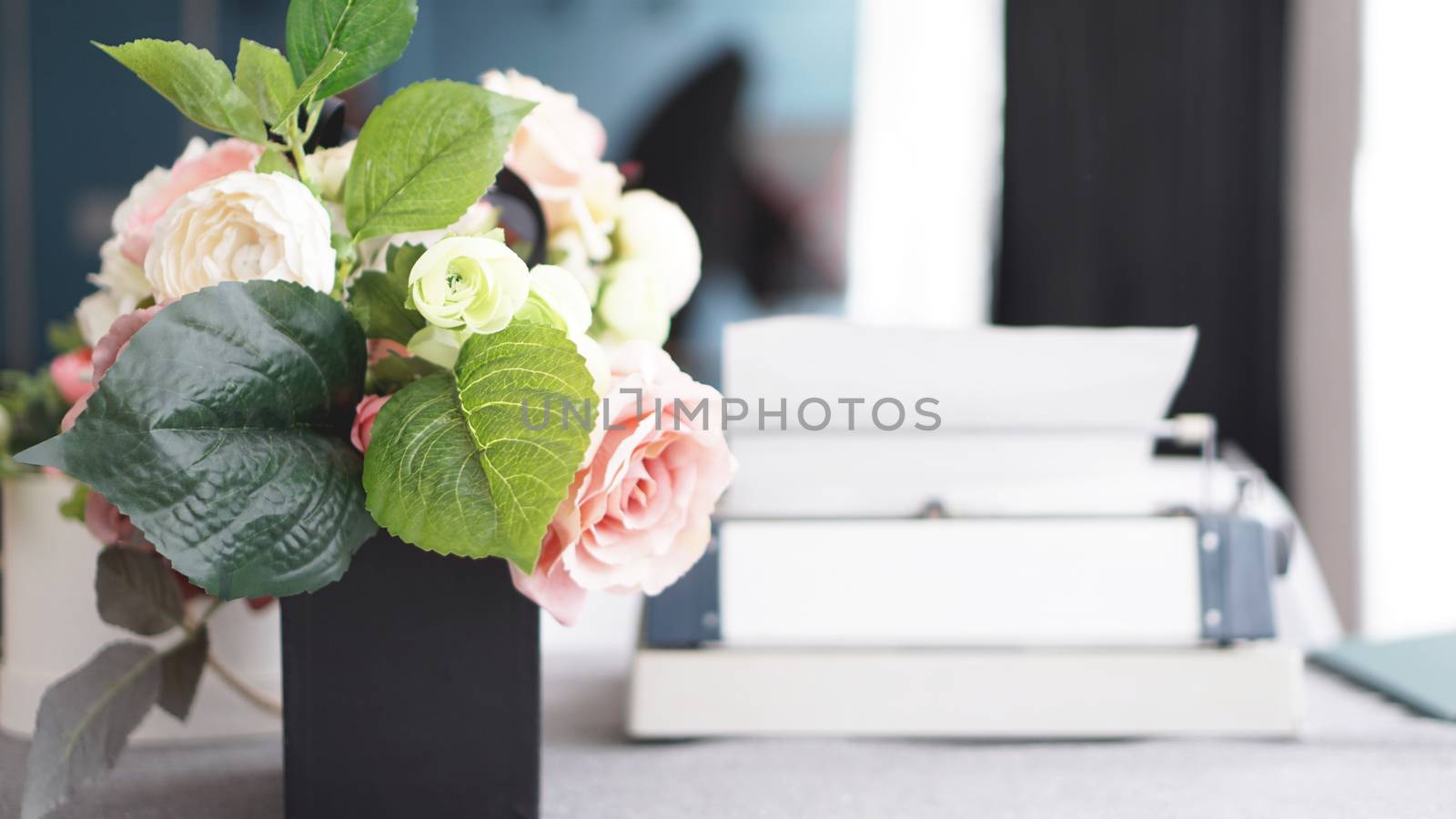 Female workspace with flowers bouquet on white background. Womens office desk by natali_brill